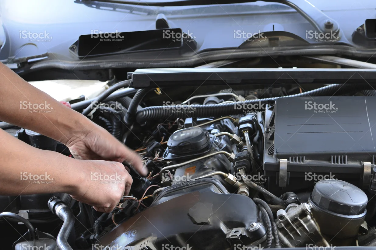 stock-photo-59328356-mechanic-under-the-hood.jpg
