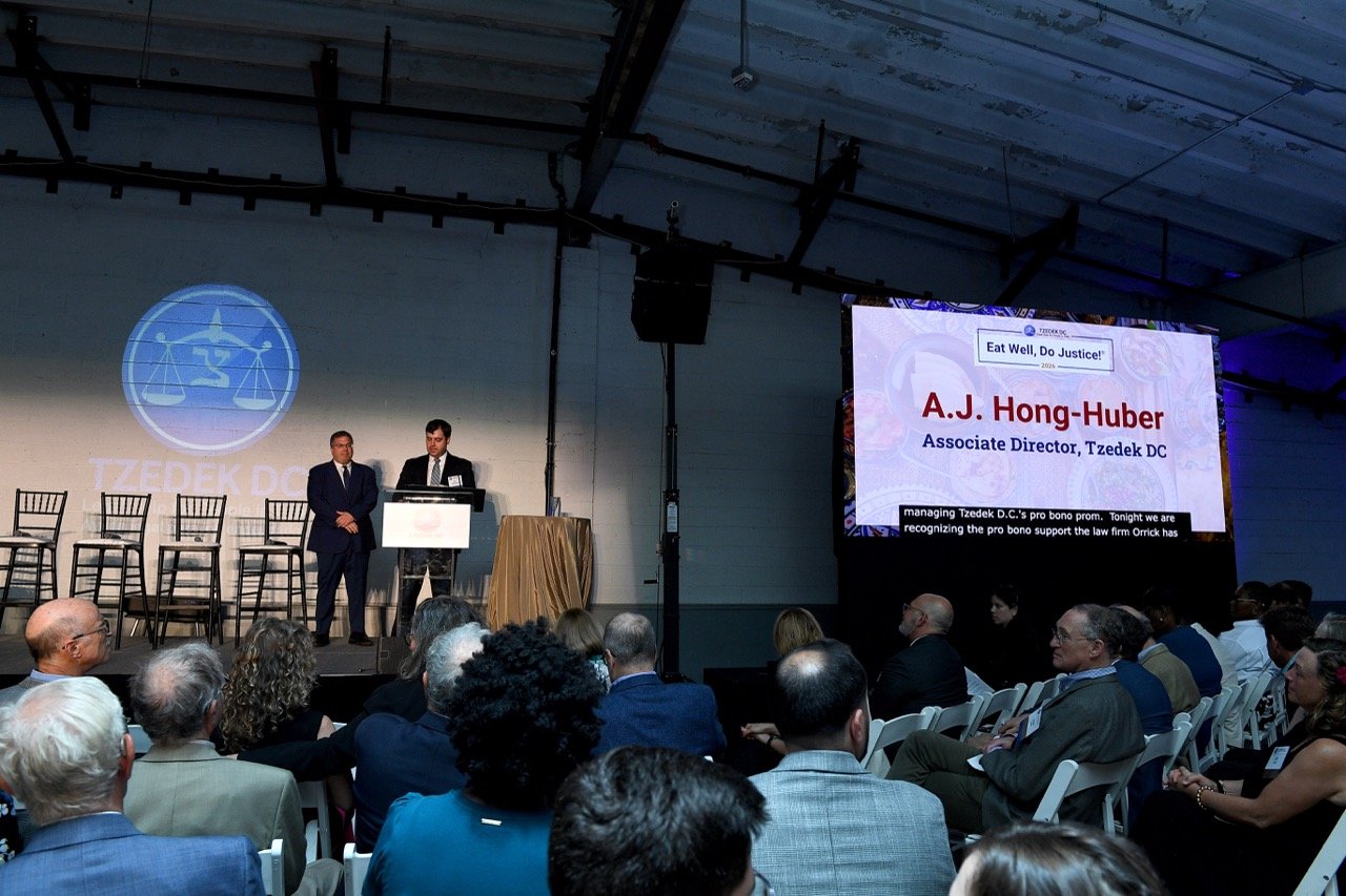 A.J. at podium, name on screen Large.jpeg