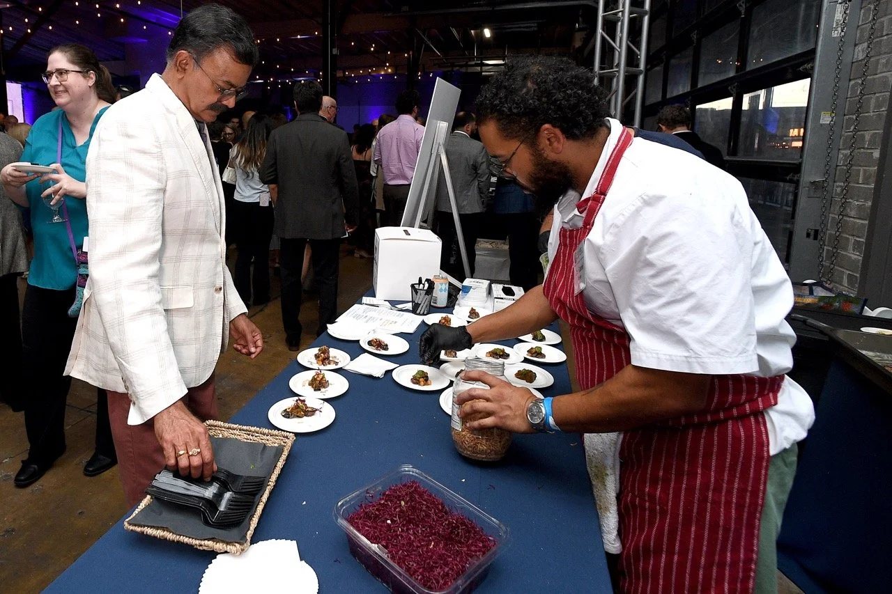 Daniel Rosen prepping plates during the event Large.jpeg