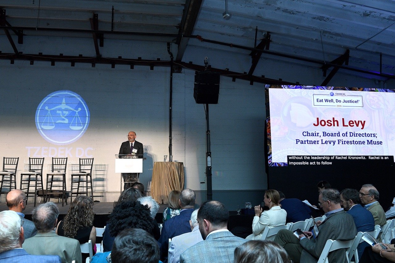 Josh Levy at podium, name on screen 2 Large.jpeg