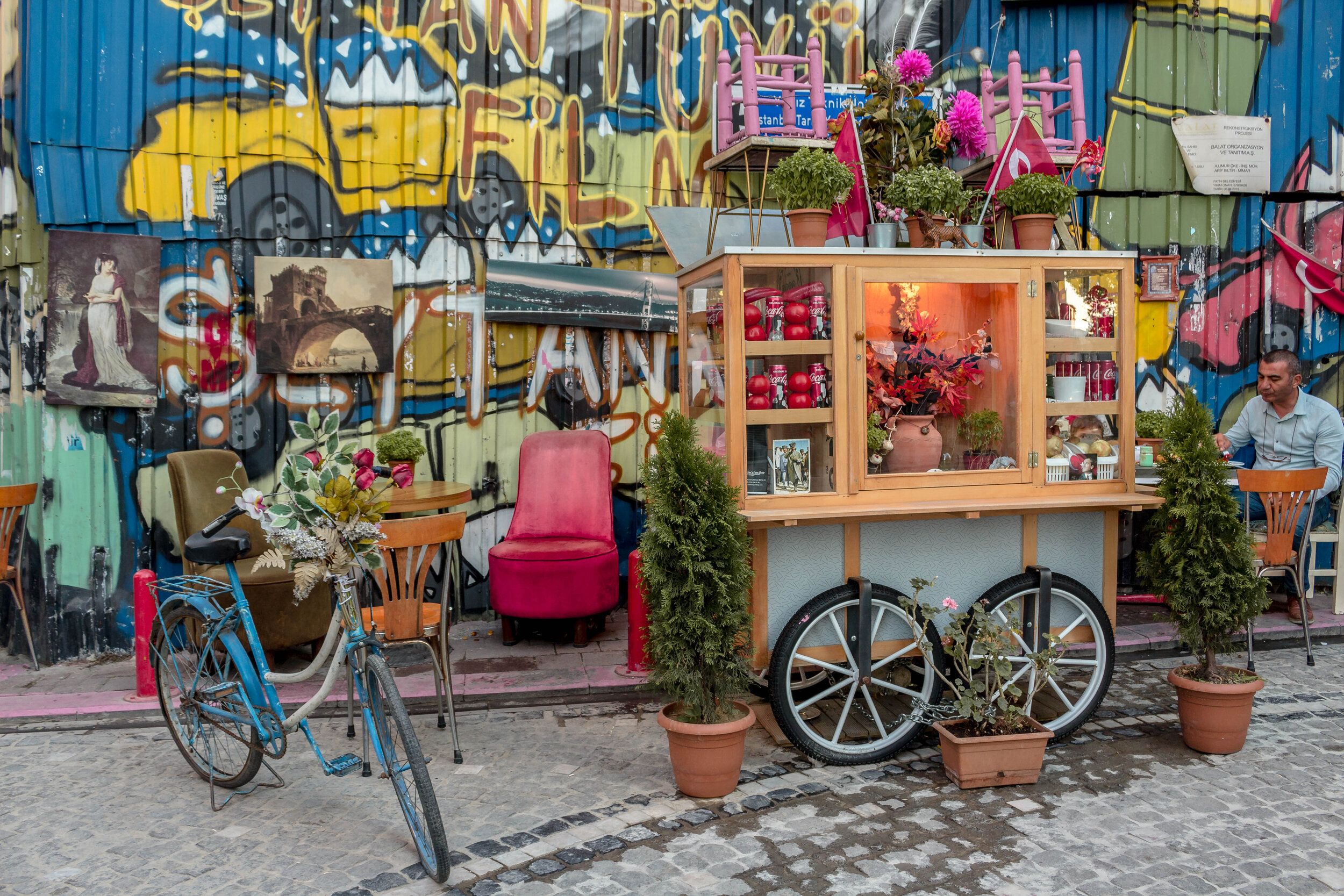 a bicycle parked in front of street art, Istanbul, Turkey