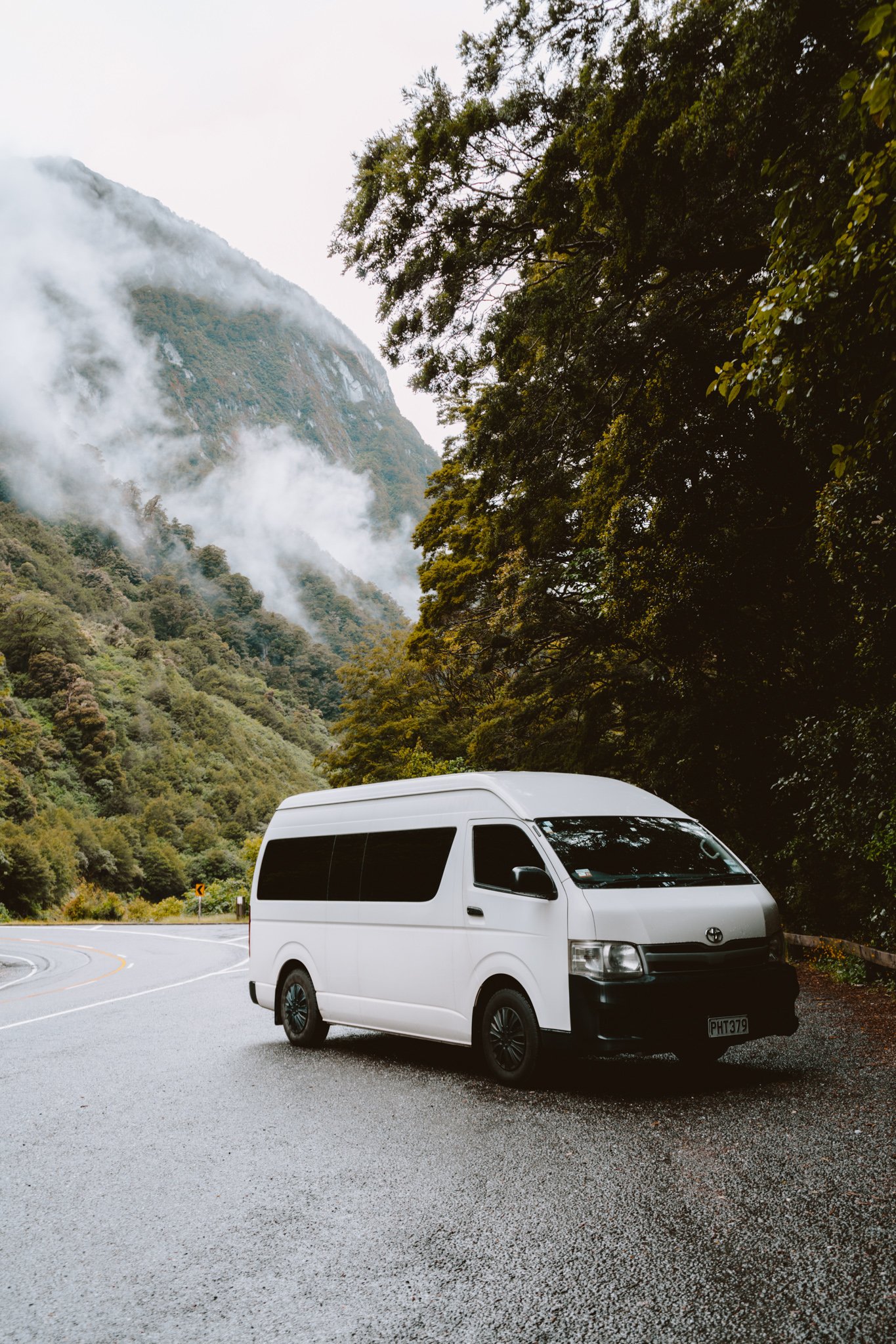 A campervan in front of New Zealand's mountainous landscape