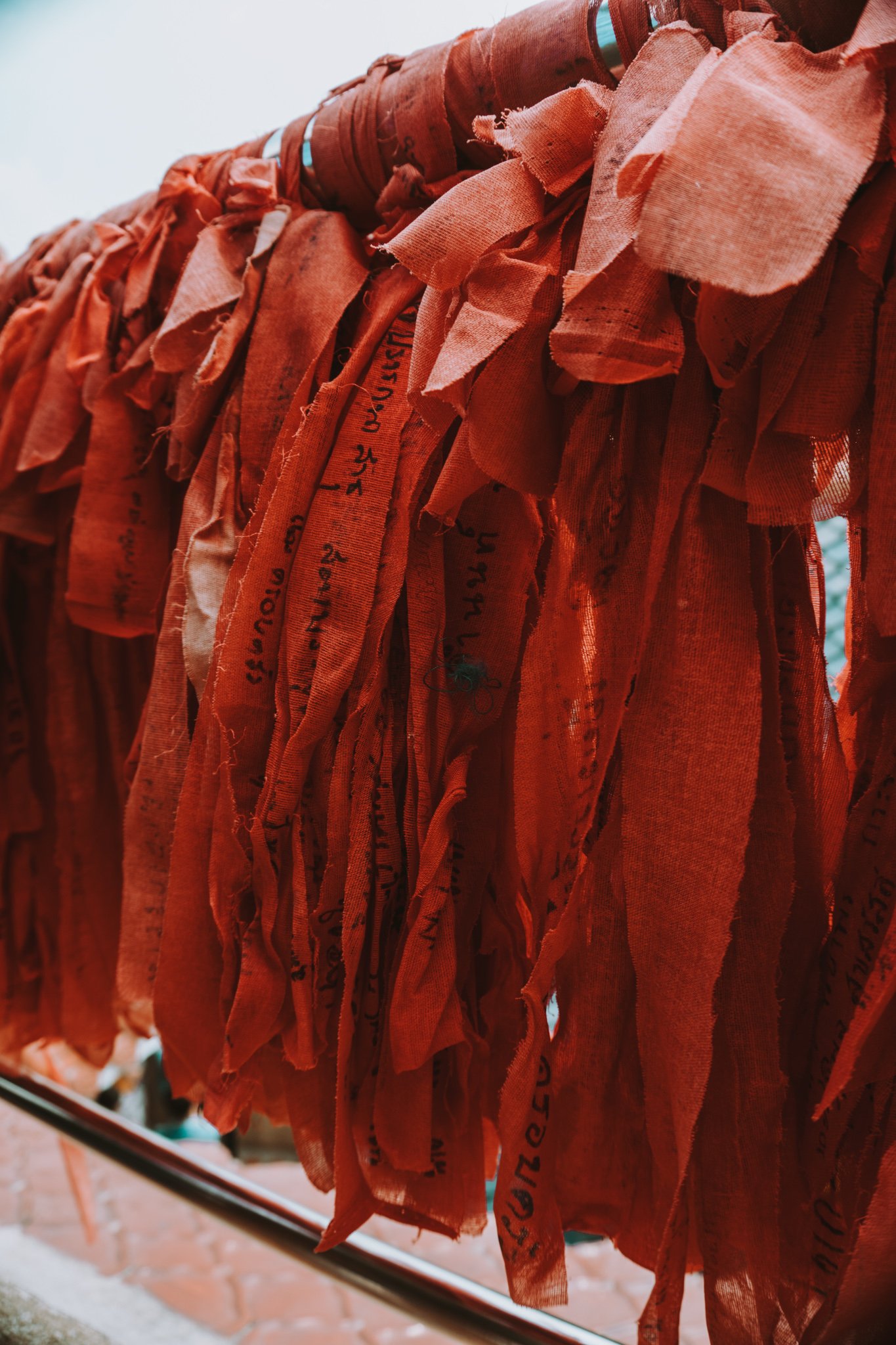 blessed cloth hanging in the Wat Samphran temple grounds