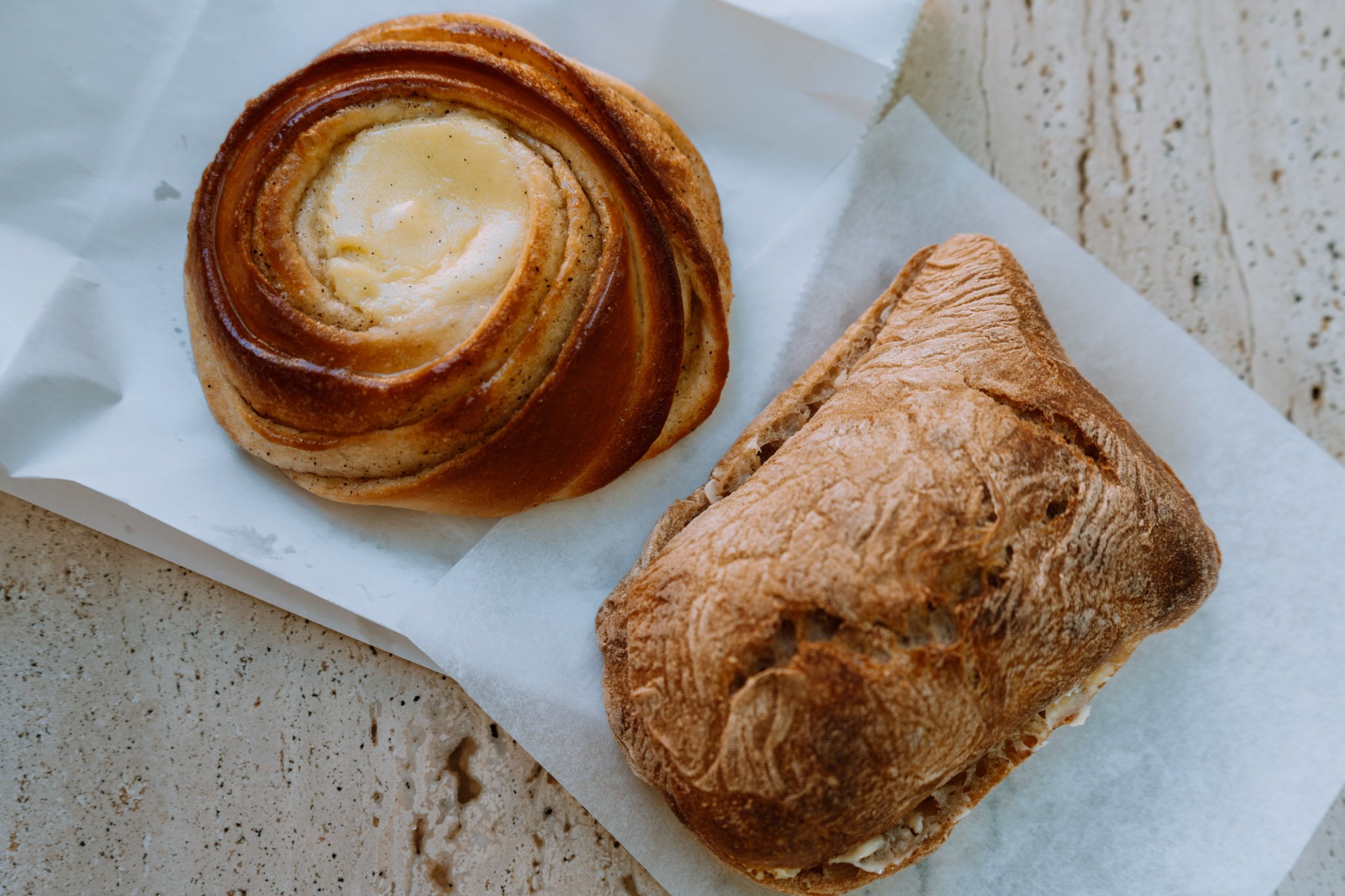 Vanilla Custard bun and sourdough roll at Juno Bakery in Copenhagen