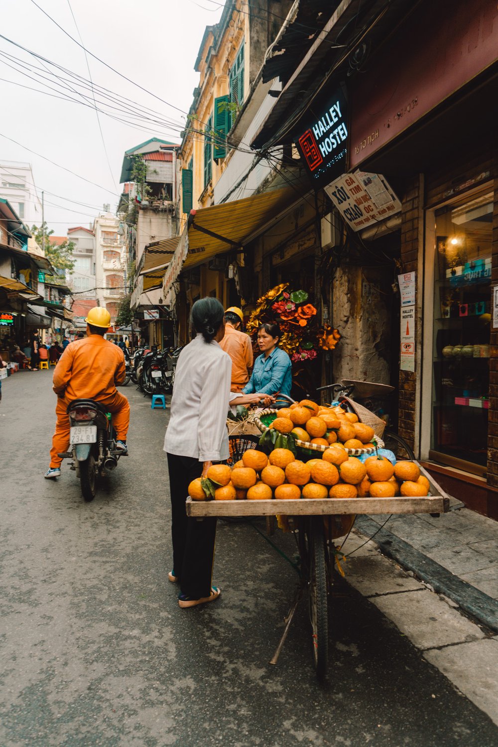 street vendor selling fruit in Hanoi, Vietnam