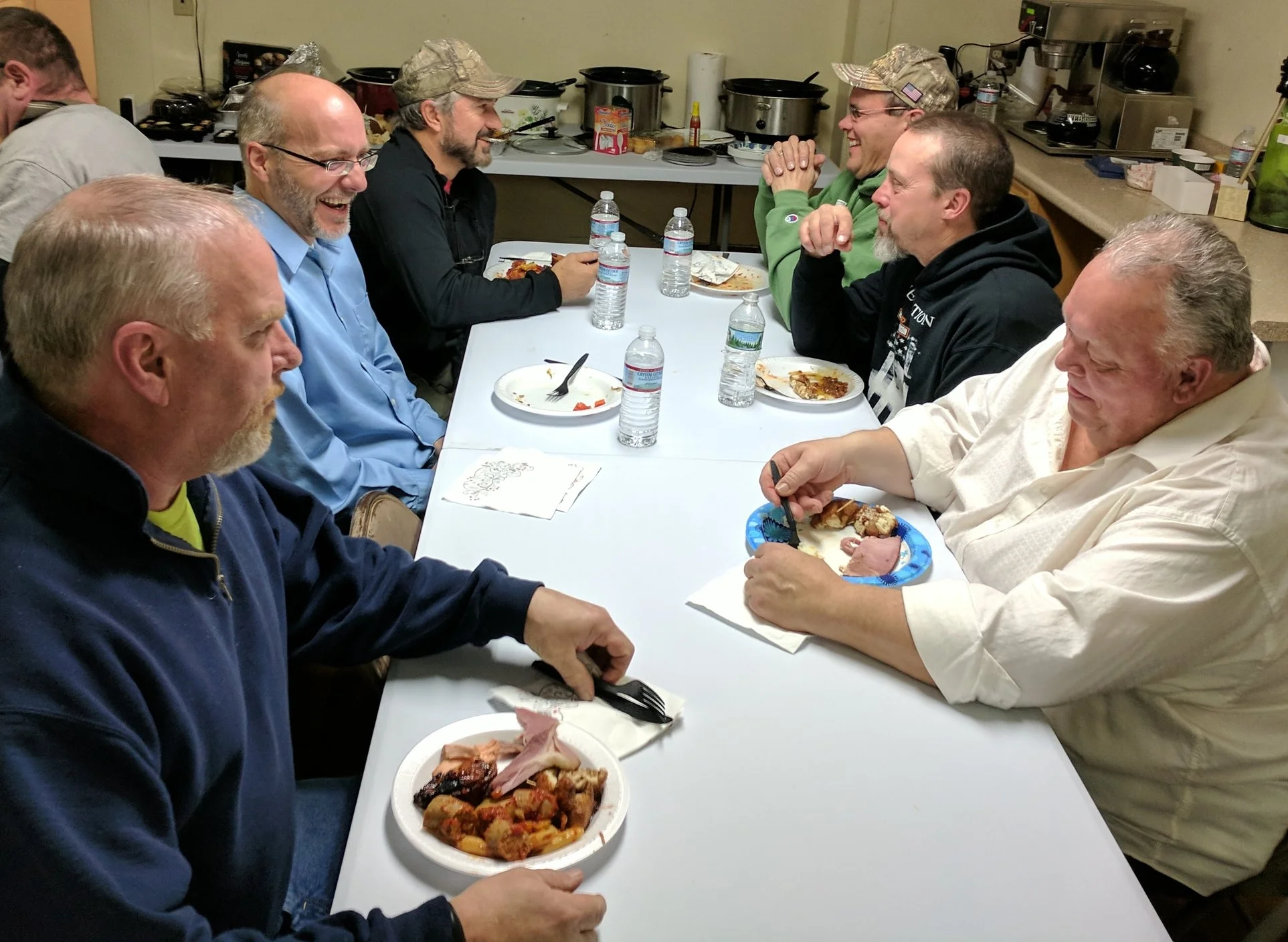 A few of the guys enjoying time together at the "Men's Christmas Feast!"