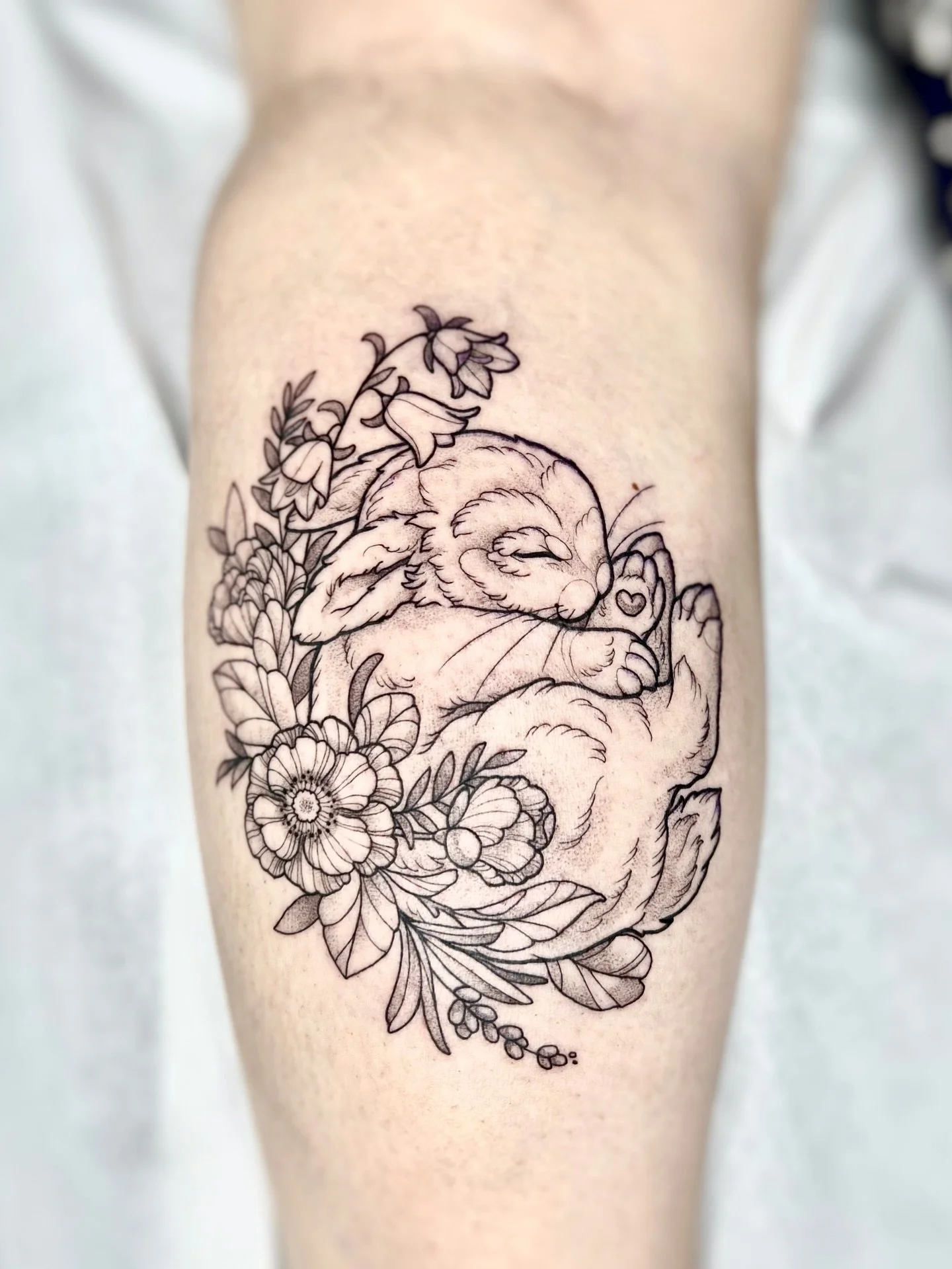 🌼 repost🐰
&bull; sleeping bunny with wildflowers from my flash sheet for Janina &bull;
&bull;
&bull;
&bull;
#animaltattoo #bunniesofig #lineworktattoo #kawaii #germantattooers #femaletattooartist #berlintattooers #nyctattooers #napallday #flowertat