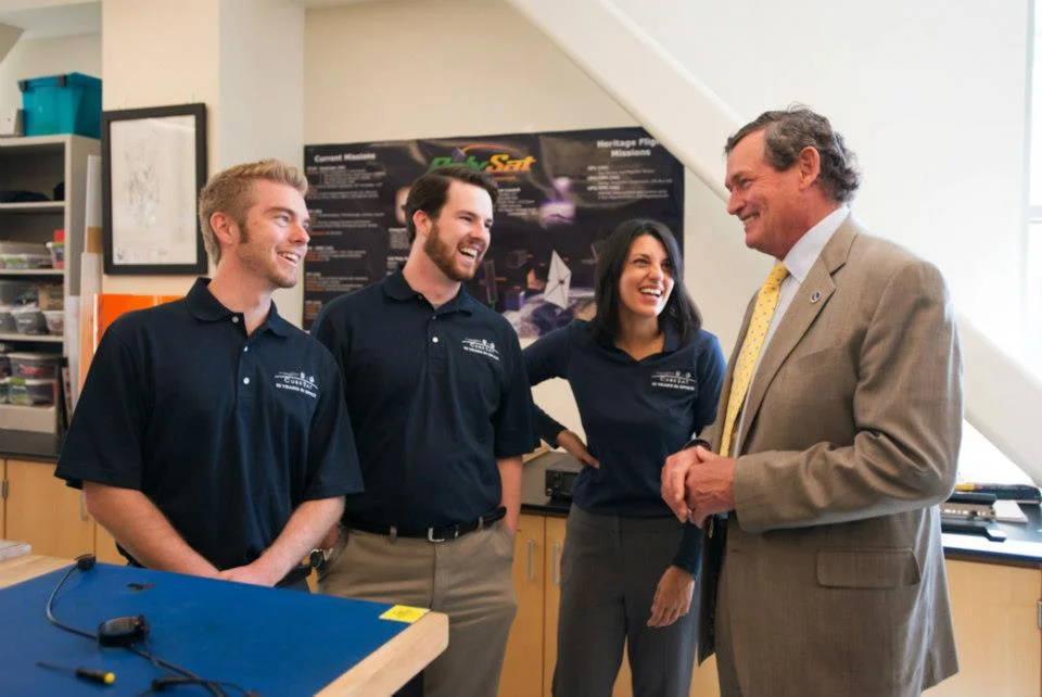 Derek Nelson, Nick Weiser, and Melody Golobic having a few laughs with the Chancellor.