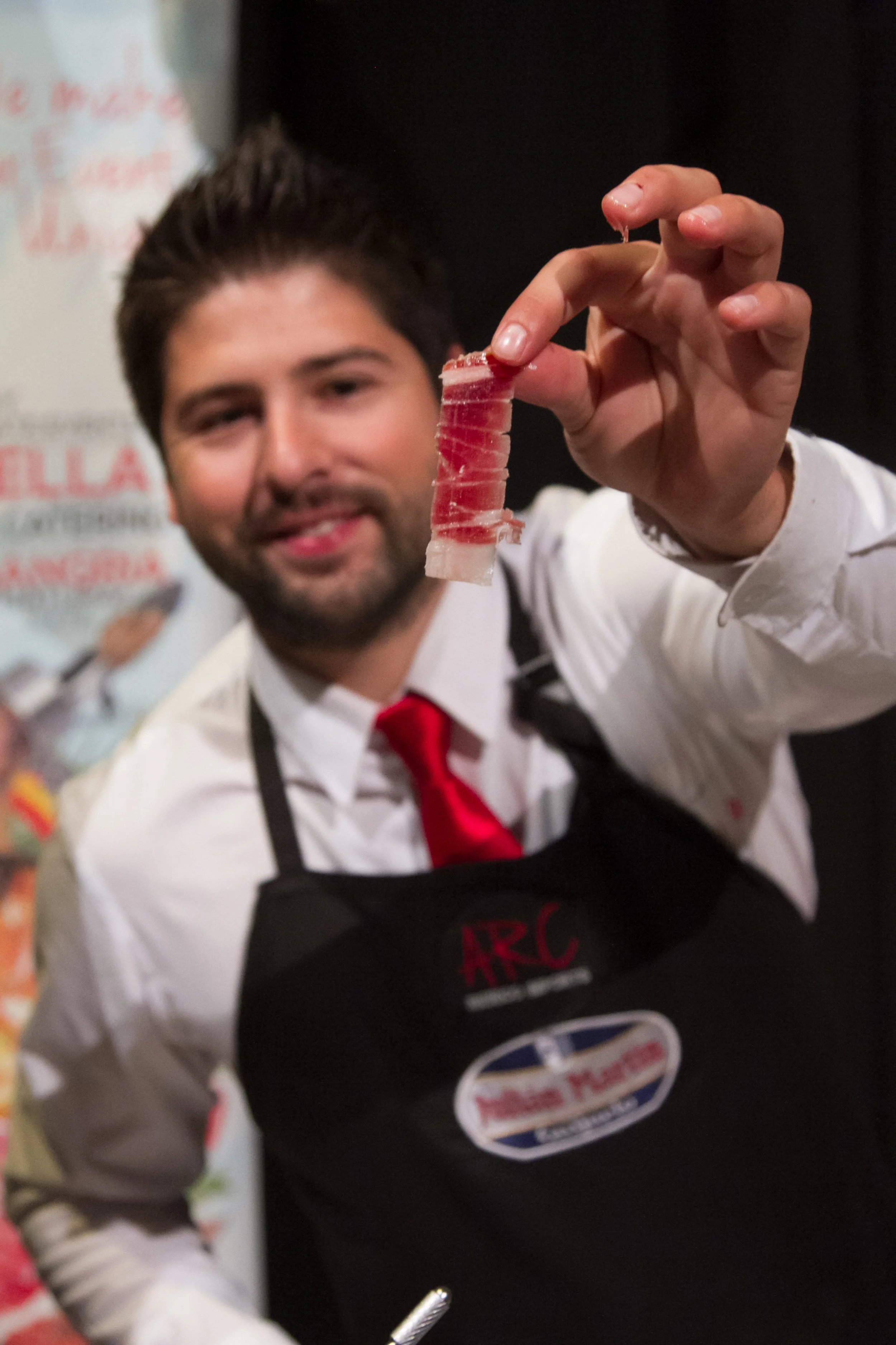 Master Ham Carver Antonio Romero Casado serving his slice-by-order Iberico prosciutto.