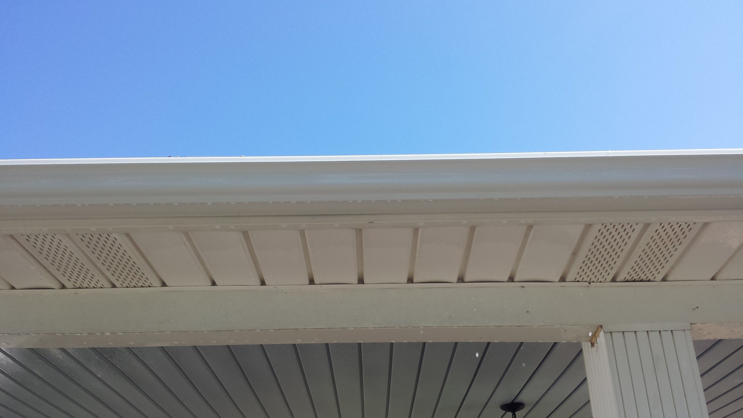 Dark "Tiger Stripes" - After. All clean!!! Looks new again. Gutter Cleaning in Lexington North Carolina.