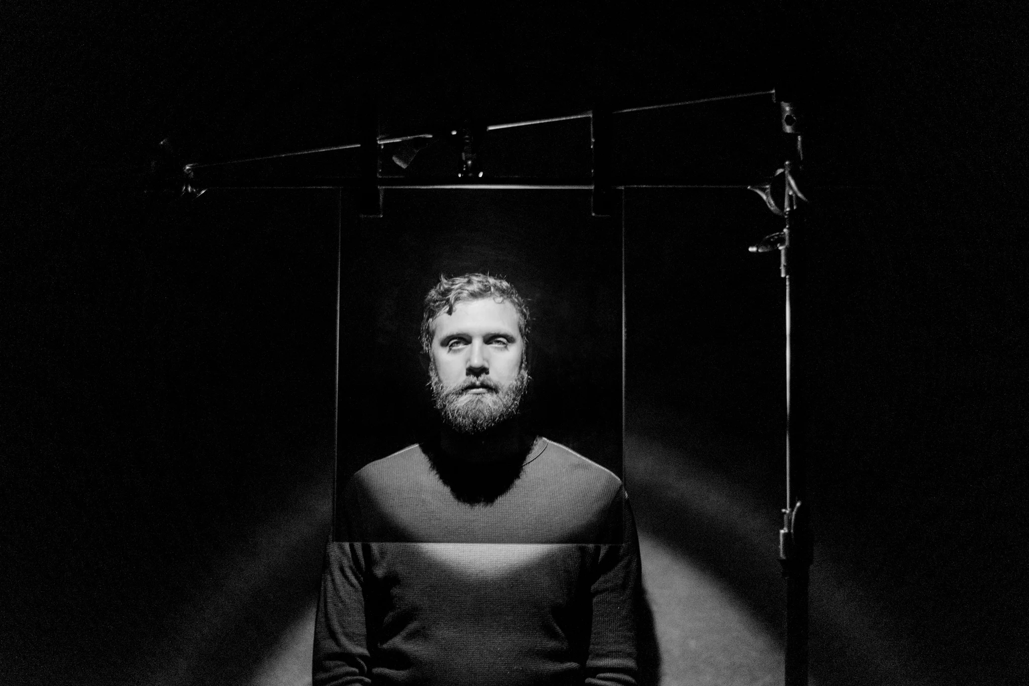 Behind the scenes image of the two way mirror from the view of the photographer. 
