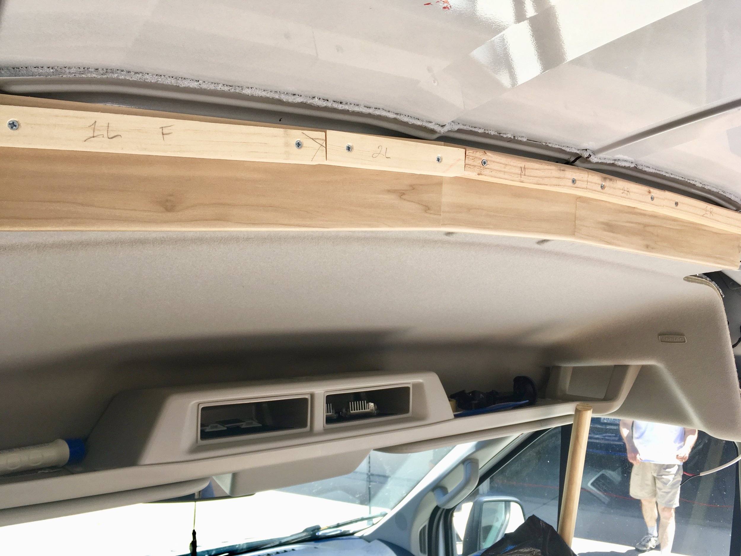 We used three screws to mount the header to the van, and then covered those screws with the furring strips for the ceiling.
