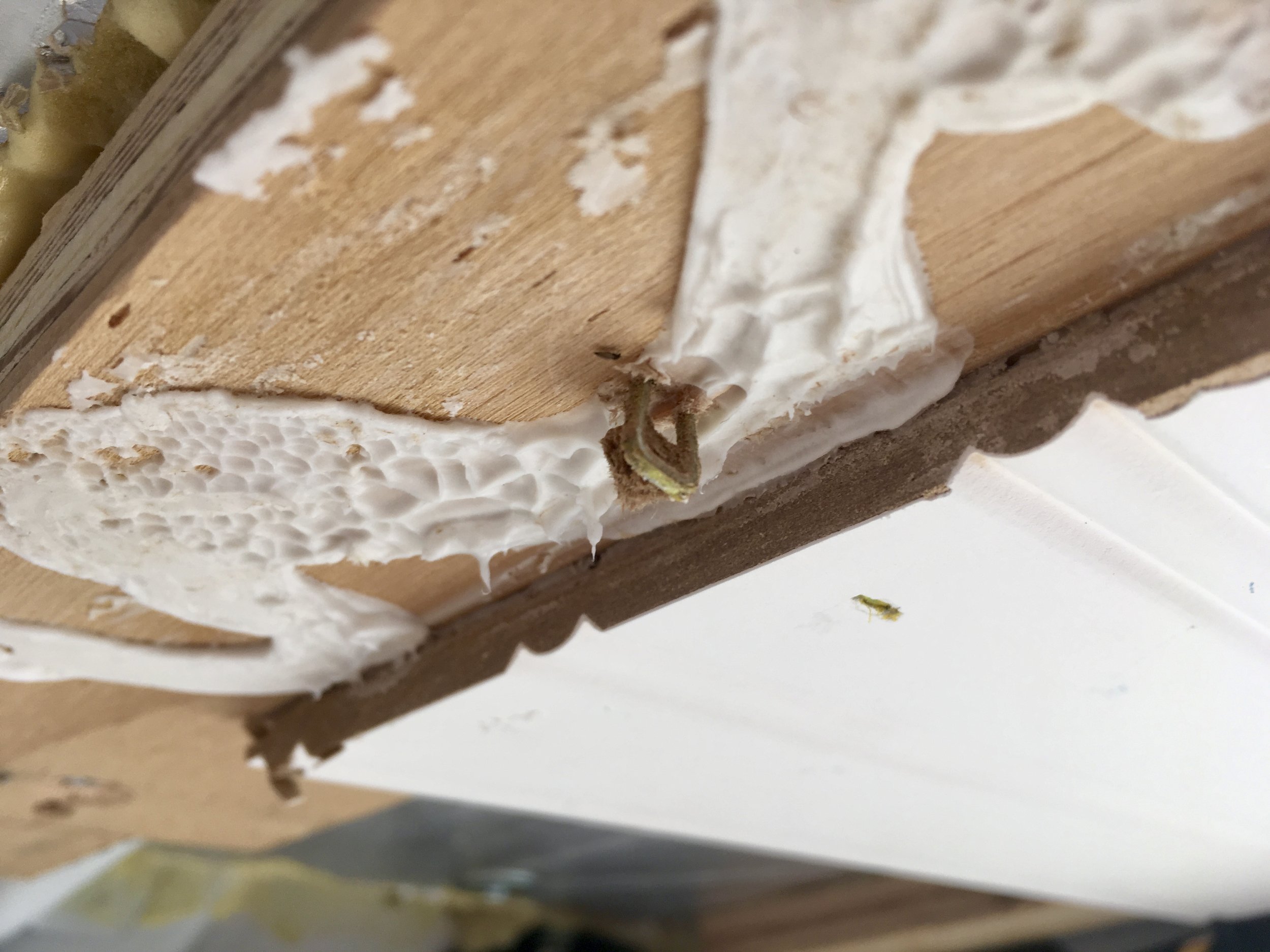 When I went back outside, I discovered I’d yanked the staple right through the board….