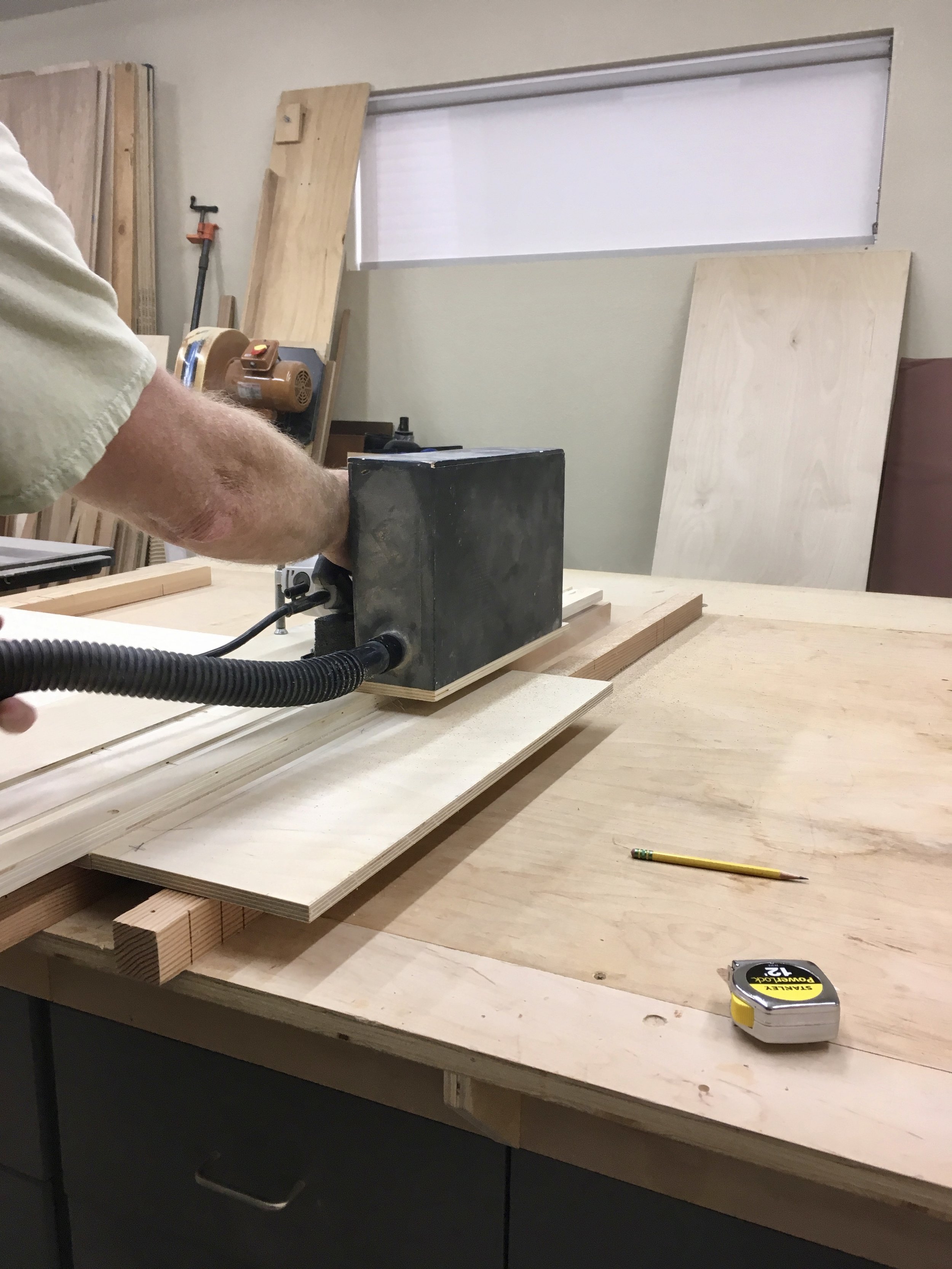 Tim’s circular saw set-up: that black box is connected to the hose so he can suck up the sawdust while he’s cutting, which is pretty darn cool.