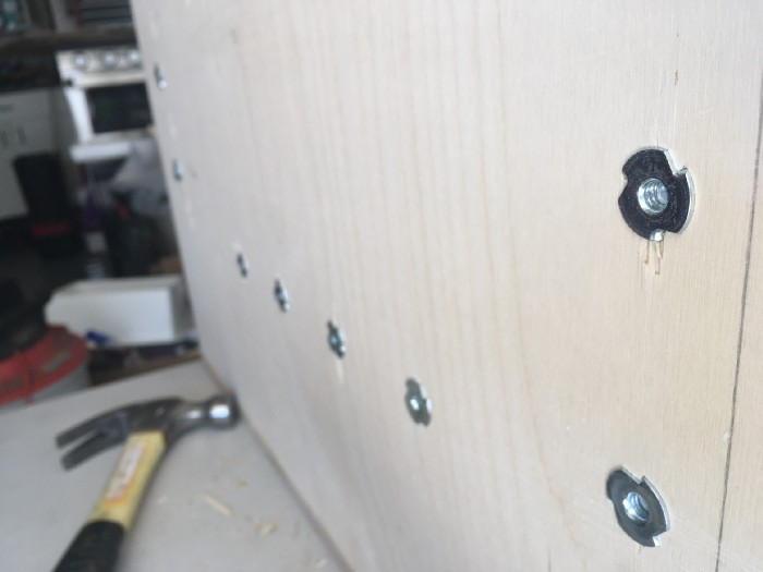 Tee knuts on the bottom of the cabinet