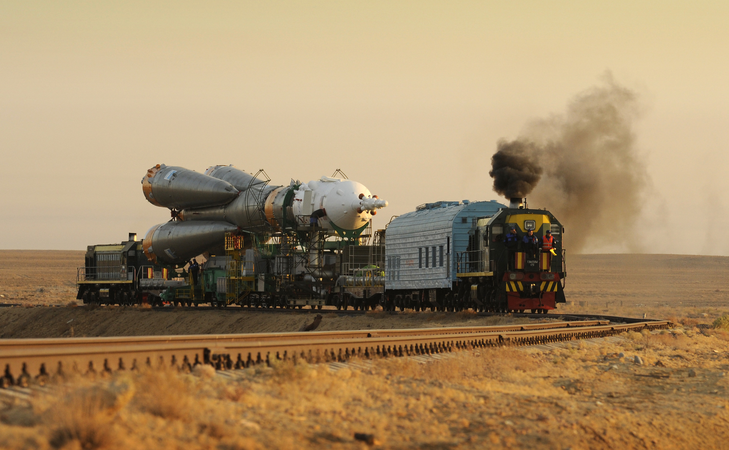  A train transports the Soyuz spacecraft and rocket to the launch pad at Baikonur Cosmodrome in Kazakhstan. Photo Credit:&nbsp;Bill Ingalls / NASA 