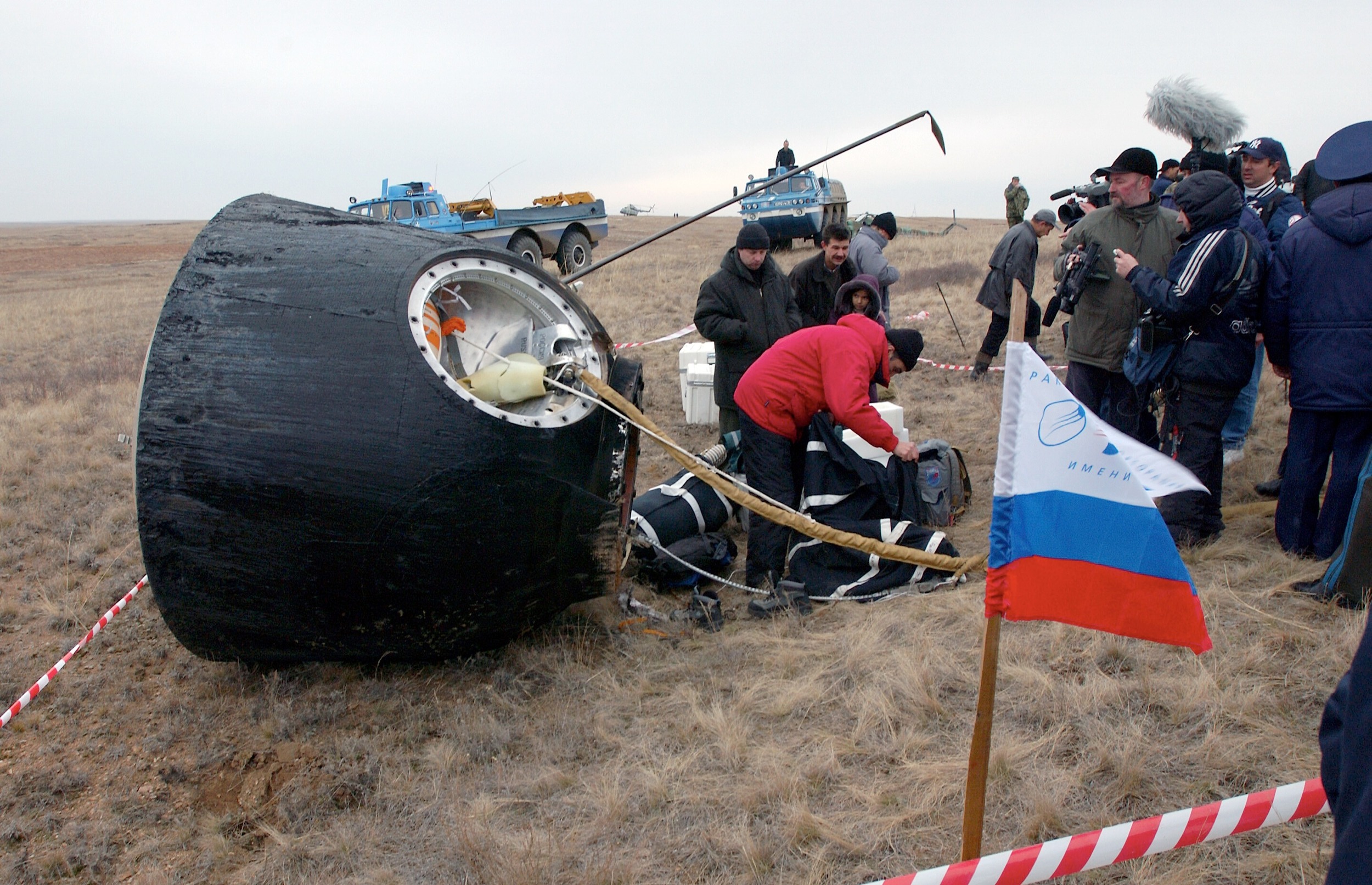  Crews of a Soyuz are extracted by ground crew after landing. Photo Credit: Bill Ingalls / NASA 