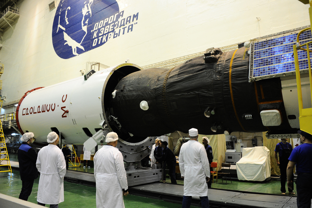 After Progress is rotated into the horizontal position, it is placed inside a protective faring for launch. Photo Credit: RKK Energia