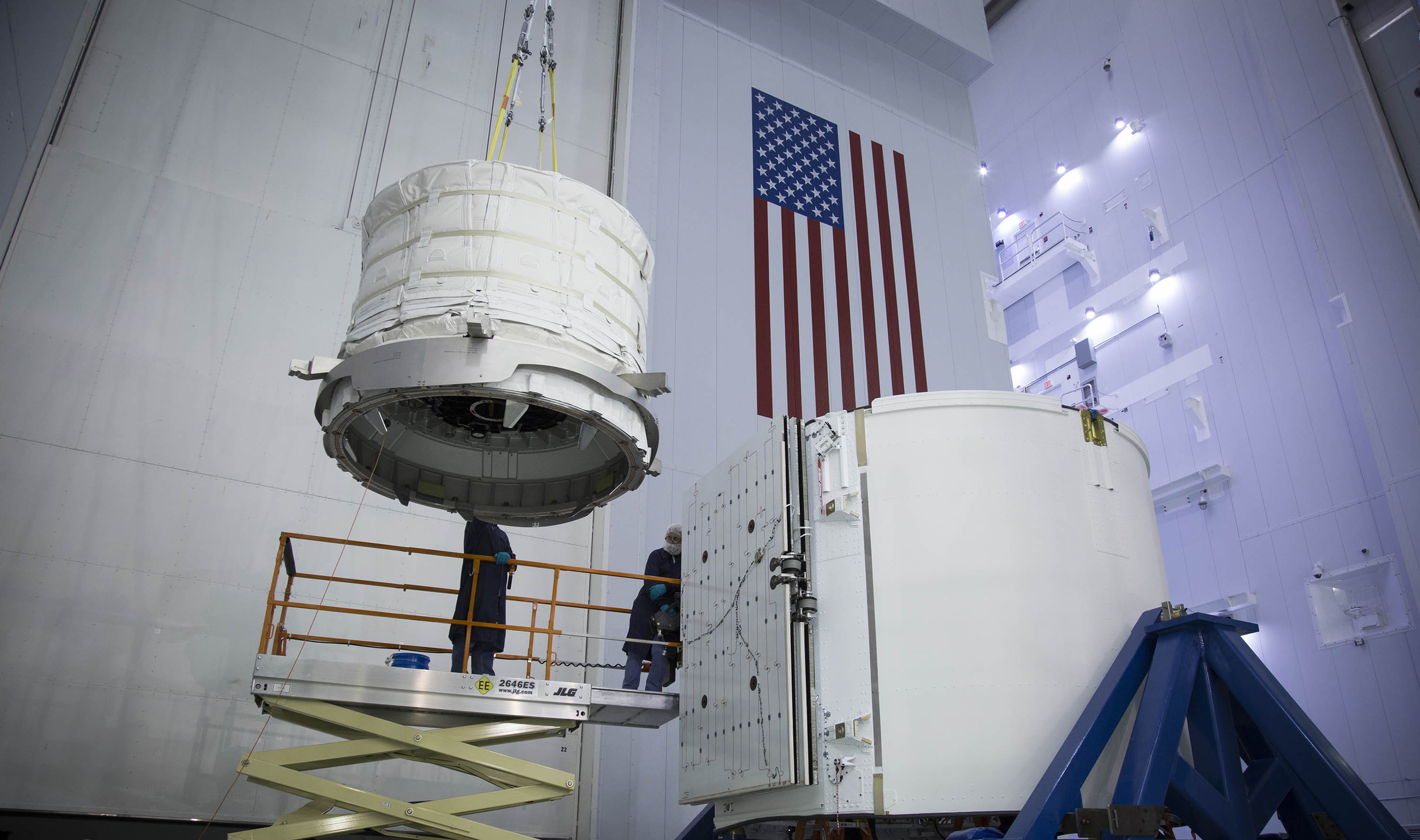  Engineers load unpressurized cargo into Dragon's Trunk prior to launch. Photo Credit: SpaceX 