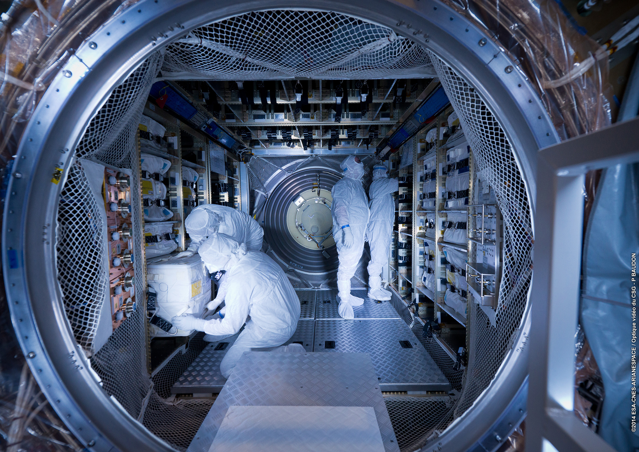 Engineers pack an ATV with supplies and food for the astronauts on the International Space Station. Photo Credit: Arianespace