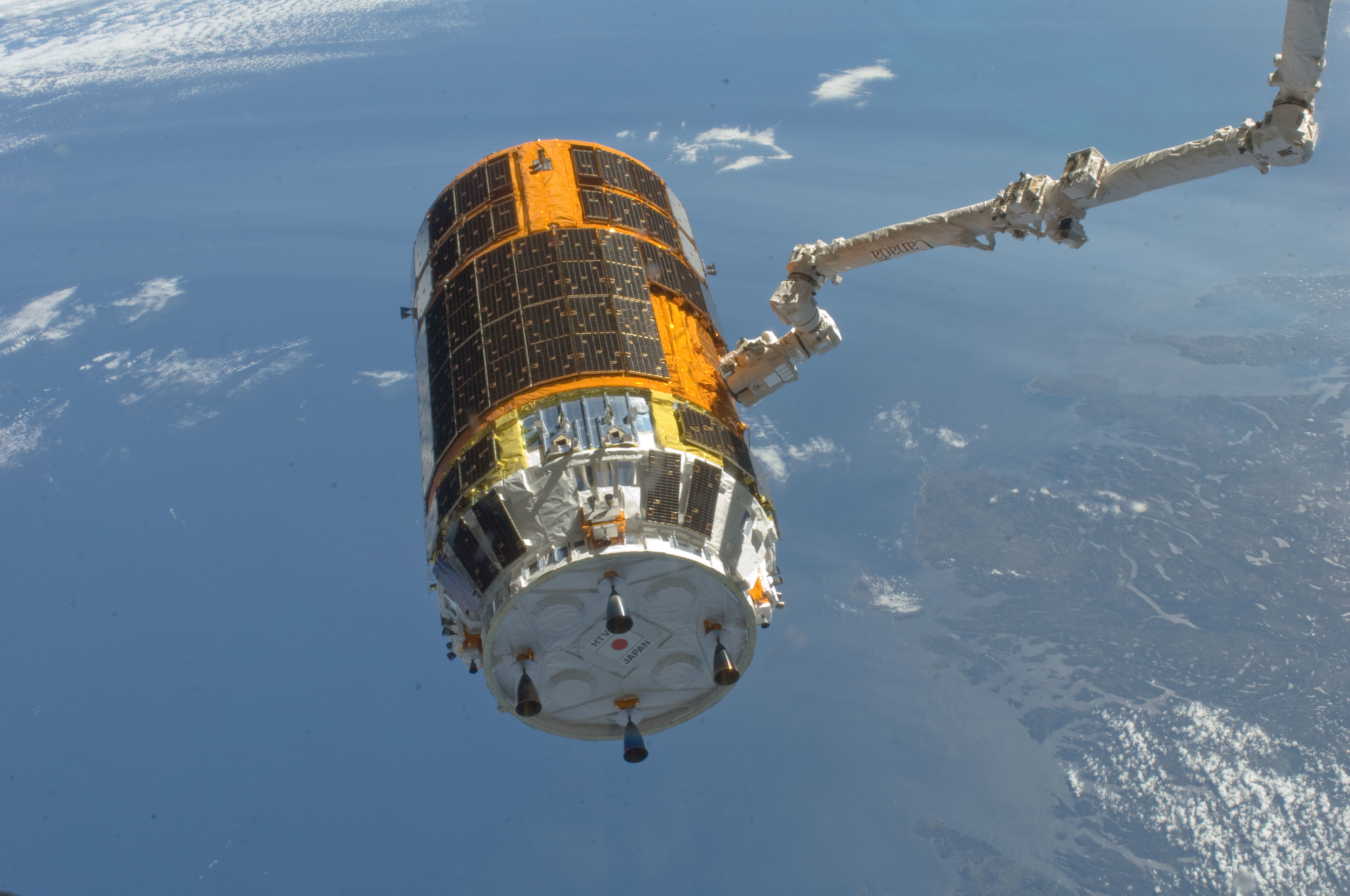   Canadarm2  positions the Kounotori for release after being loaded with trash. Photo Credit: NASA 