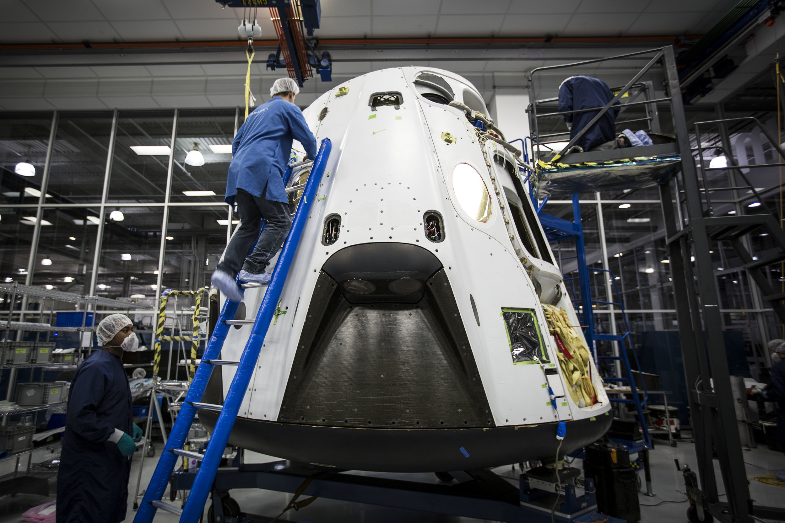  Engineers prepare a Crew Dragon for the Pad Abort test in 2015. Photo Credit: SpaceX 