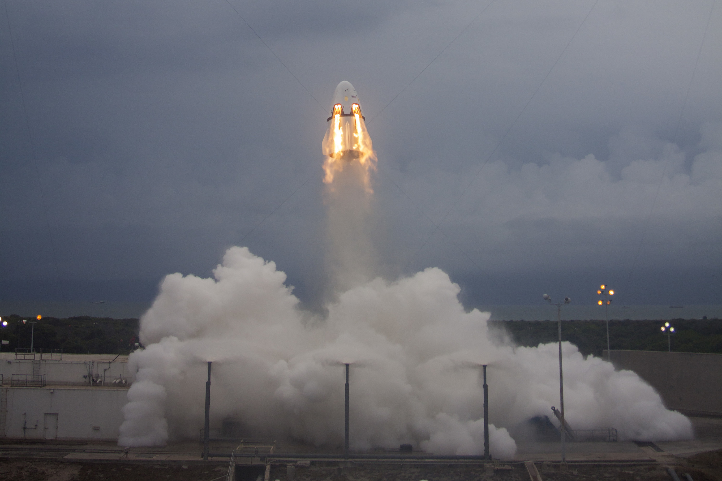  Crew Dragon flies skyward, testing the SuperDraco thrusters in the Pad Abort test on May 6, 2015. Photo Credit: SpaceX 