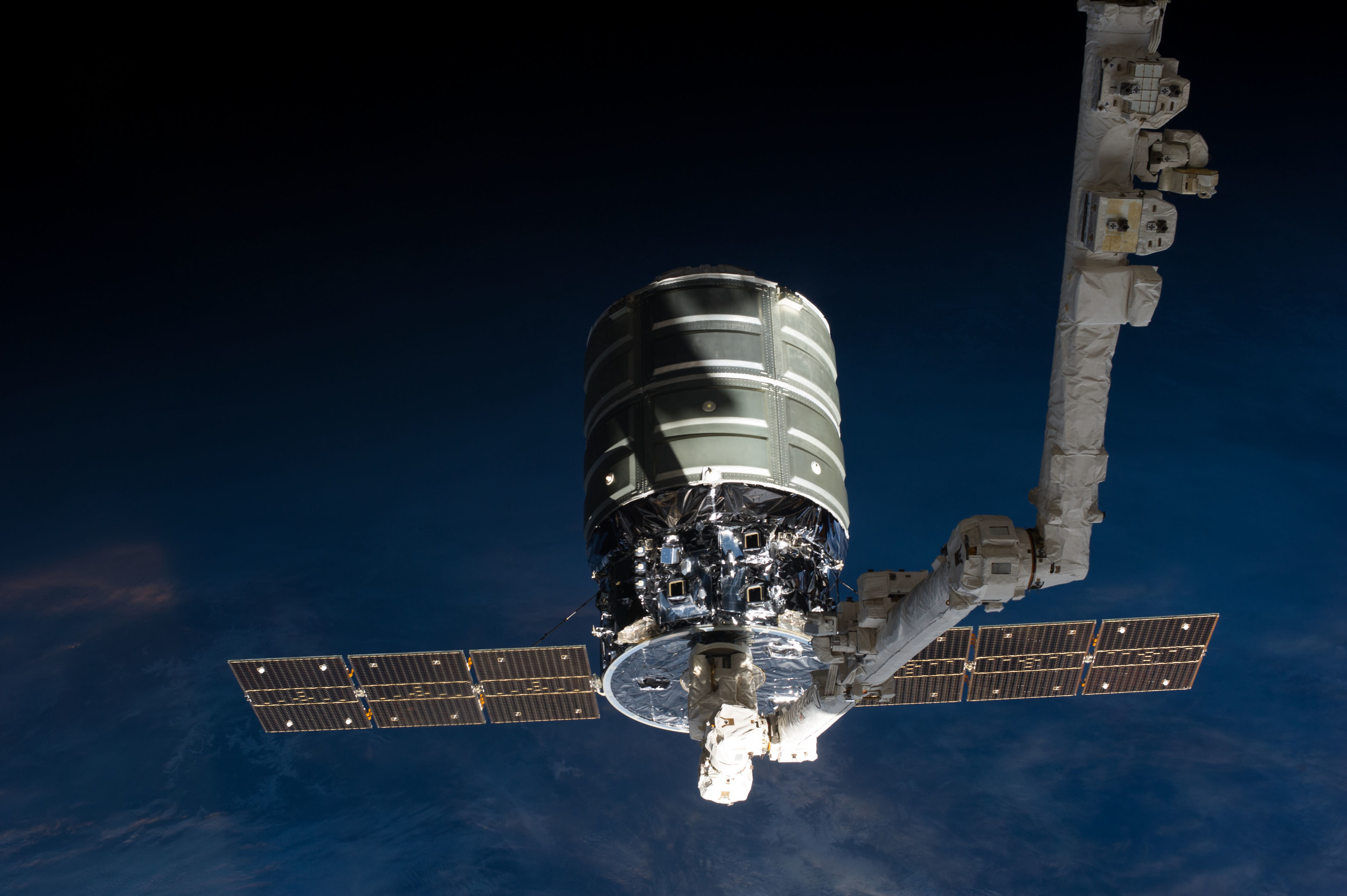  A first-generation Cygnus is grappled by  Canadarm2 . Photo Credit: NASA 