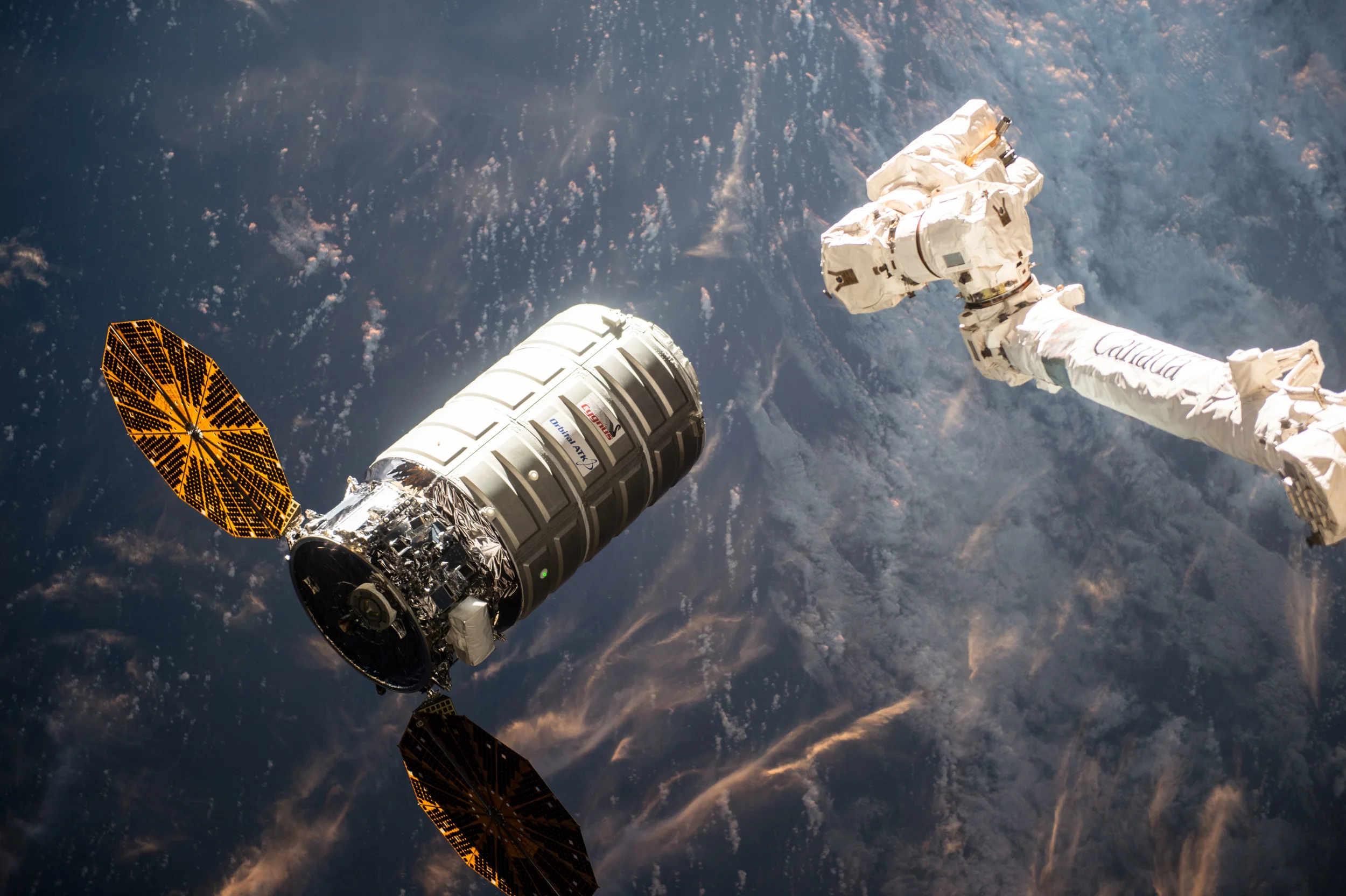 Cygnus moments away from being "grabbed" by the space station's robotic arm. Photo Credit: NASA