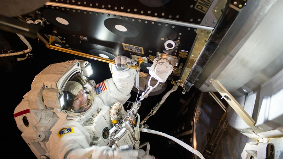 Jeff Williams is seen at PMA-2 during EVA-36 installing IDA-2. Photo Credit: Kate Rubins / NASA