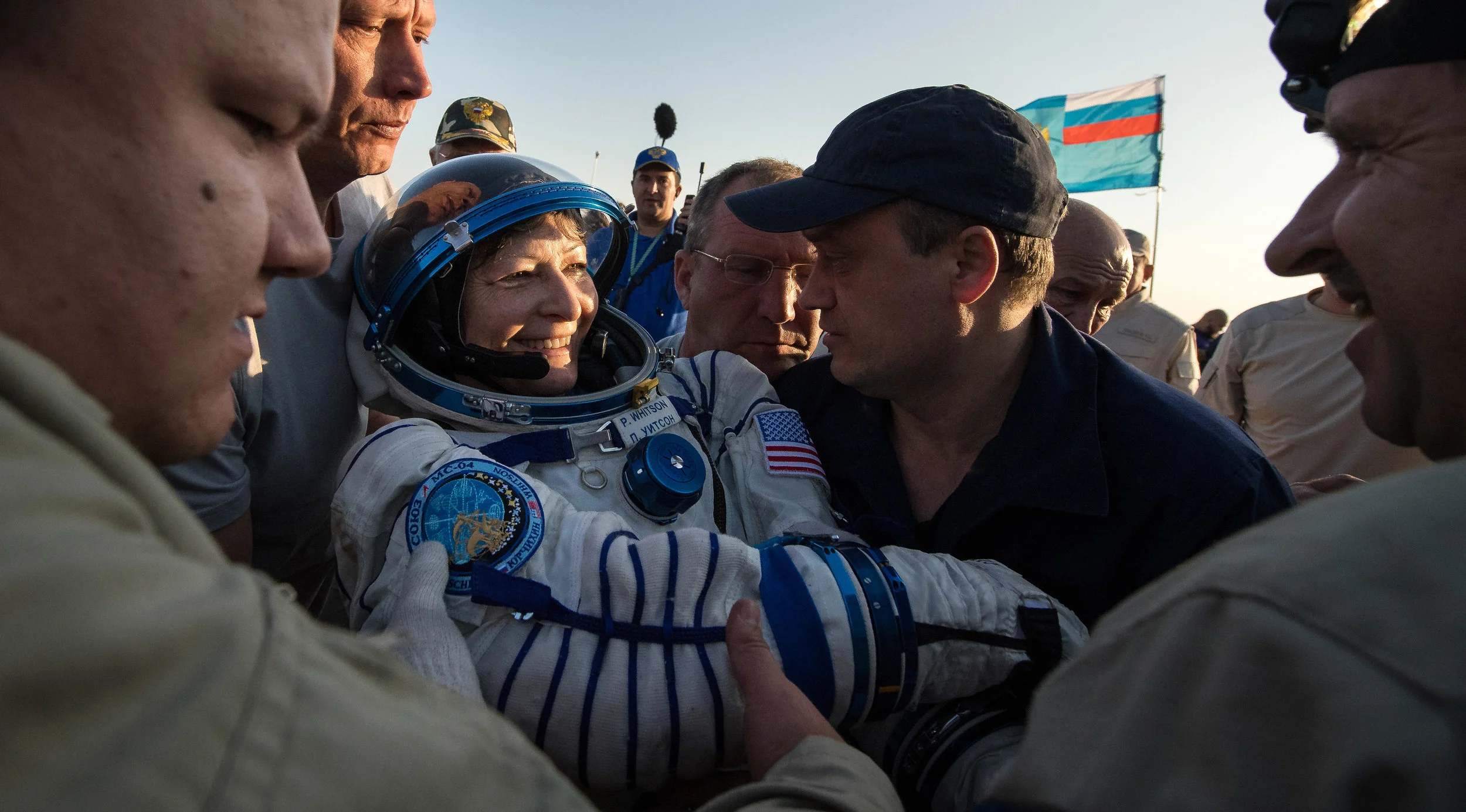 Peggy Whitson was the final crew member of Soyuz MS-04 to be helped out. All three were placed on lawn chair-like couches for an initial health check before being transported to a nearby medical tent for further evaluation. Photo Credit: Bill Ingalls / NASA