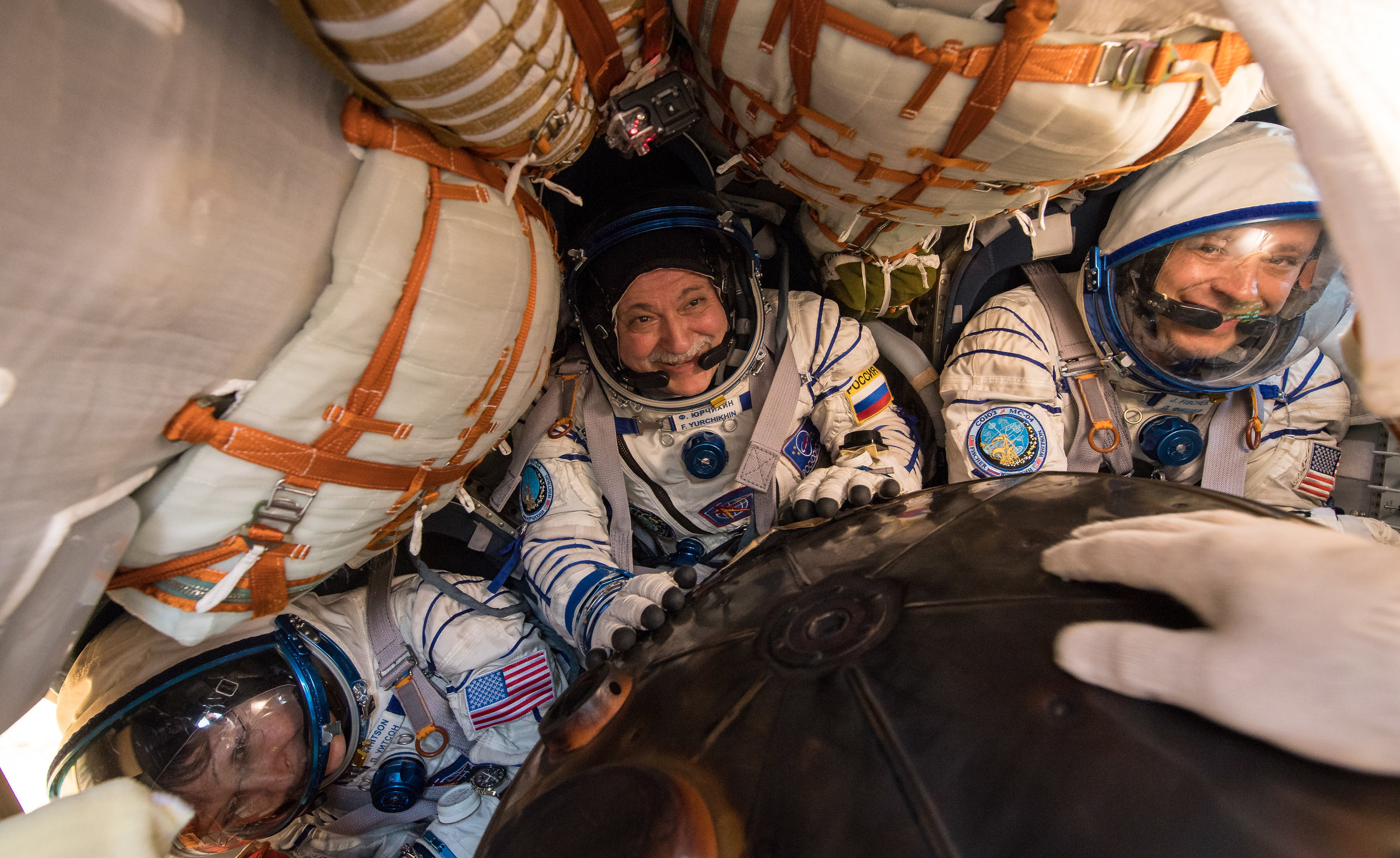  Expedition 52 Flight Engineer Peggy Whitson, left, Commander Fyodor Yurchikhin of Roscosmos, center, and Flight Engineer Jack Fischer get their first taste of fresh air in months. Whitson was in space for 288 days, while Yurchikhin and Fischer were 