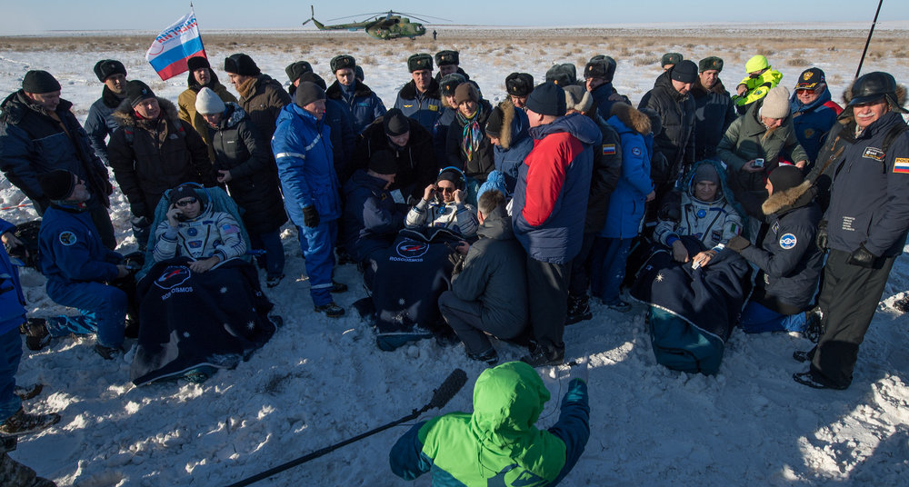  The Soyuz MS-05 crew sits in couches outside the spacecraft before being flown to a staging area and ultimately their respective space agencies. Credit: NASA/Bill Ingalls 