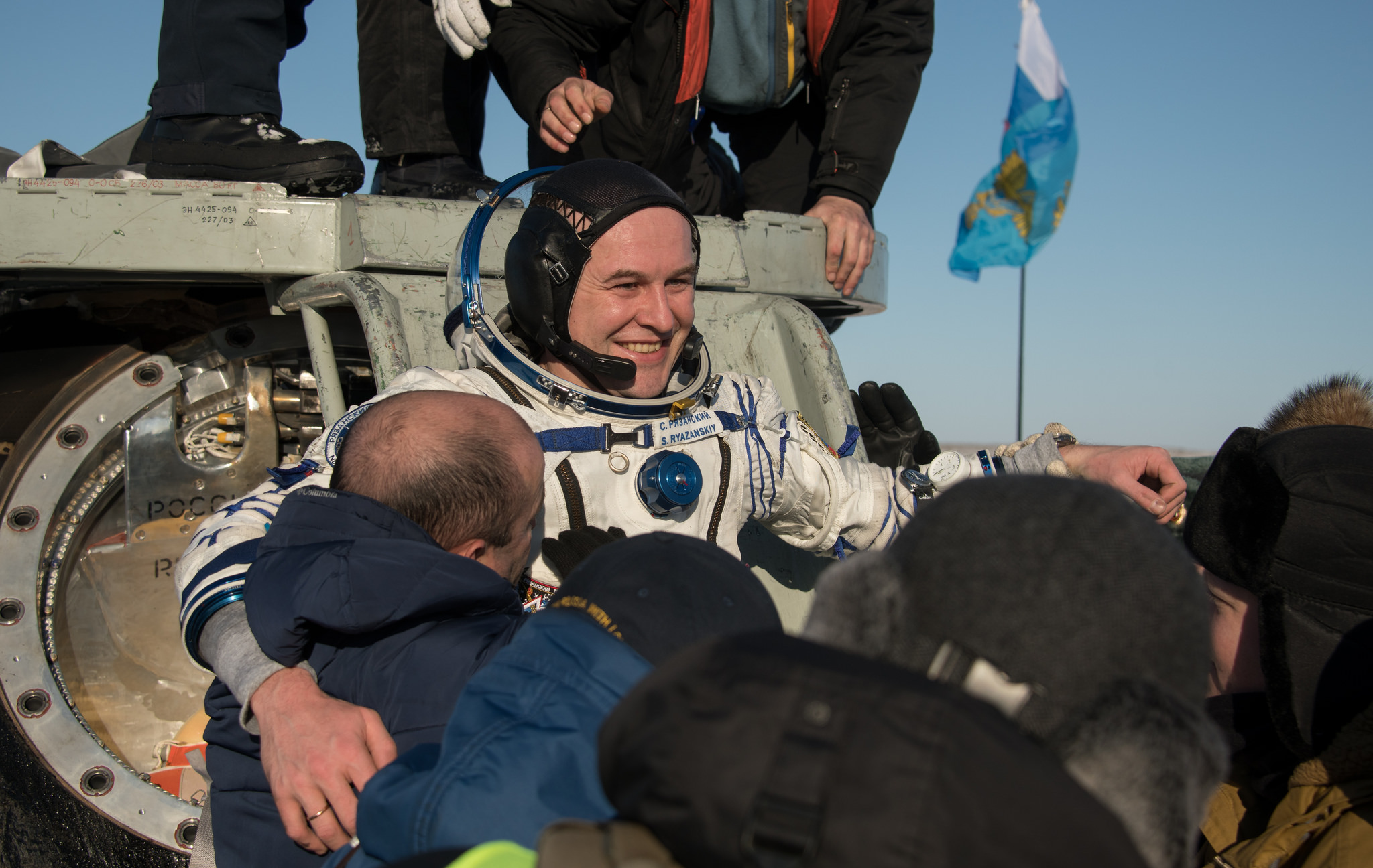  Sergey Ryazansky is helped out of the Soyuz MS-05 spacecraft. Credit: NASA/Bill Ingalls 