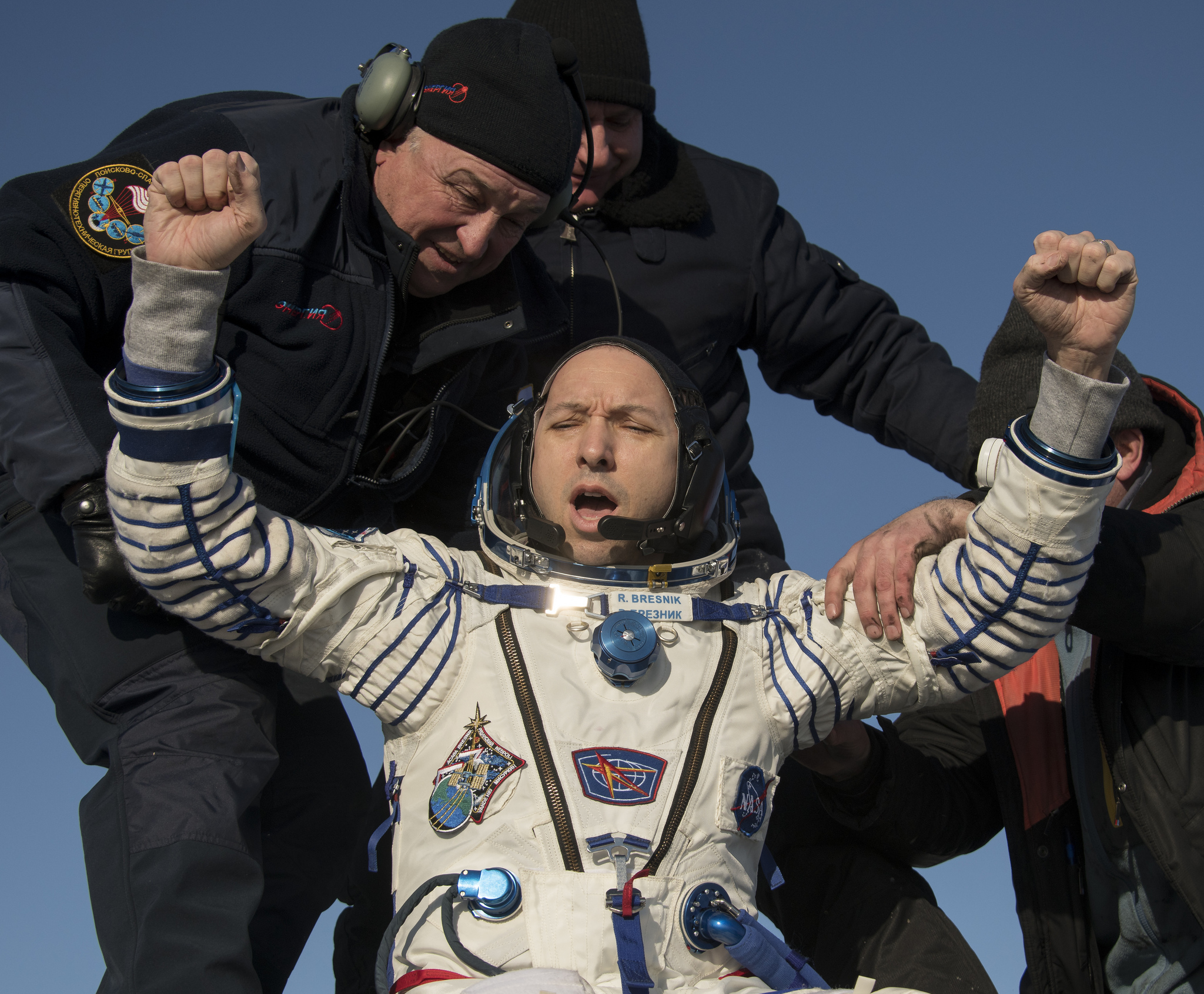 Randy Bresnik is helped out of Soyuz MS-05. Credit: NASA/Bill Ingalls