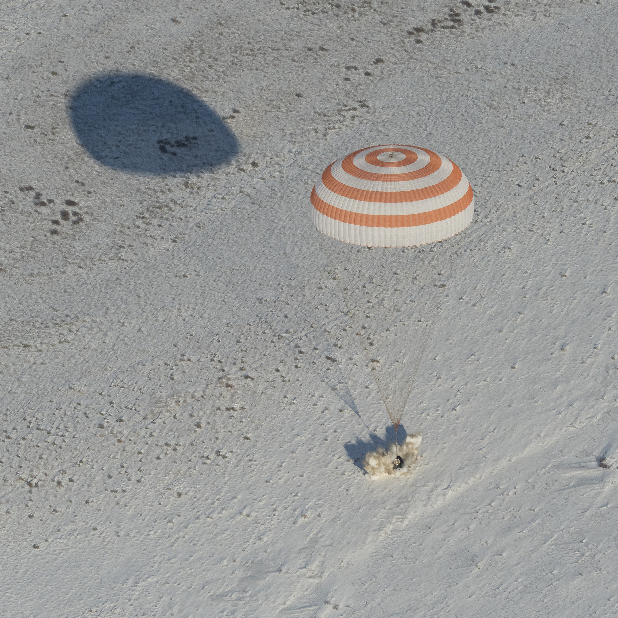  The Soyuz MS-05 capsule fires its landing jets to cushion the impact of touchdown. Credit: NASA/Bill Ingalls 