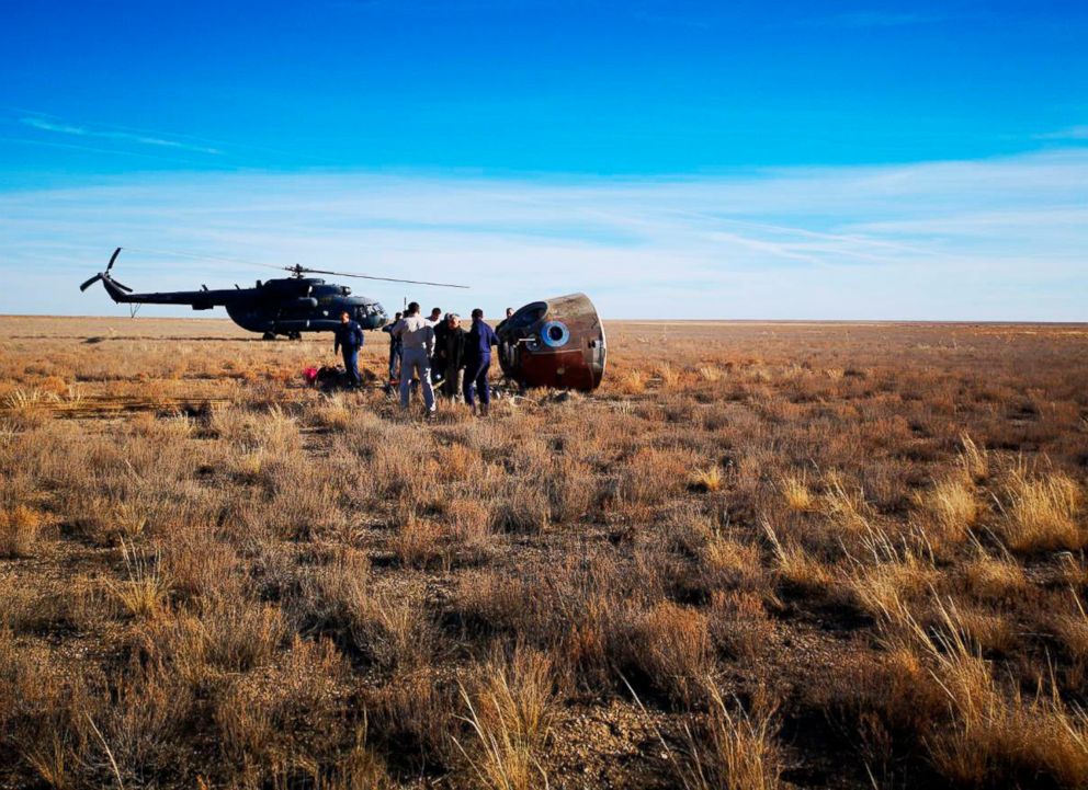  Search and rescue teams meet with Aleksey Ovchinin and Nick Hague in their capsule right as they land. Landing took place about 30 minutes after launch. Credit: Russian Defense Ministry Press Service 