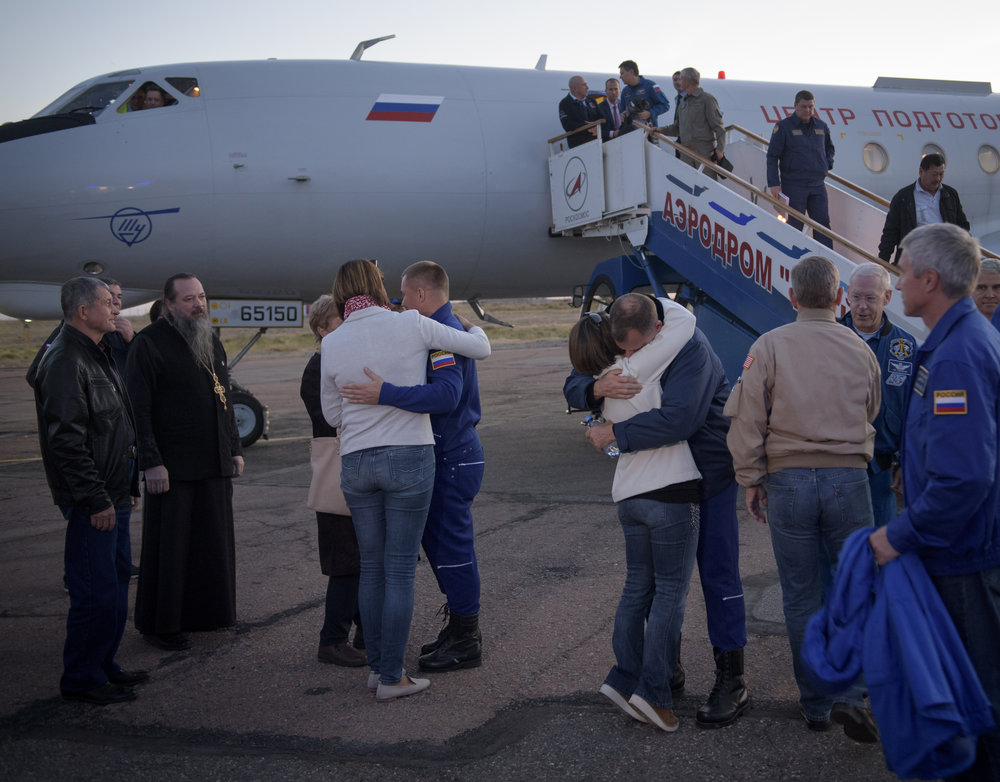  After recovery, the crew were flown back to Baikonur Cosmodrome to be reunited with their family and friends. Credit: NASA/Bill Ingalls 