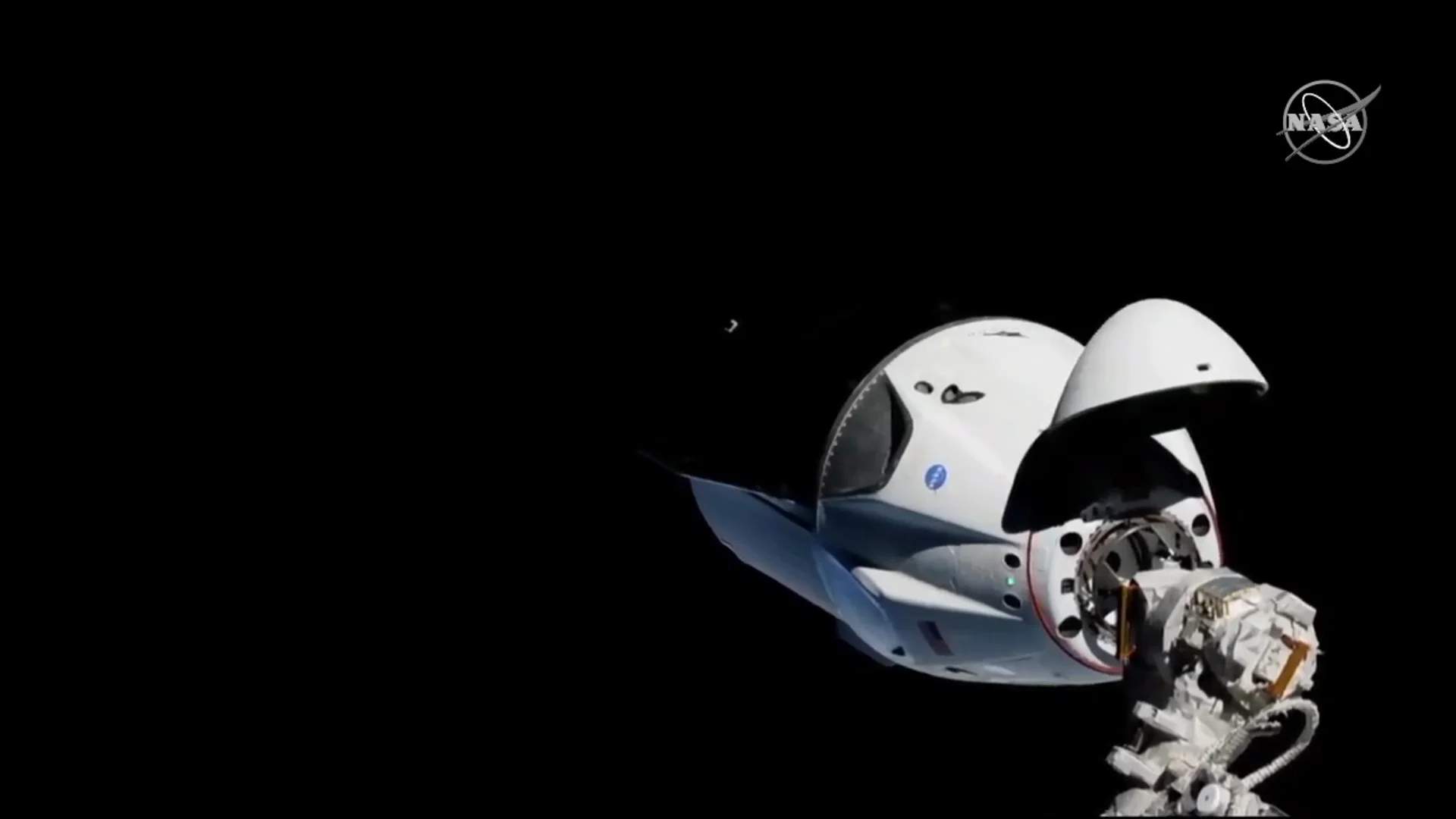 Crew Dragon as it holds its position about 20 meters from the outpost. Credit: NASA