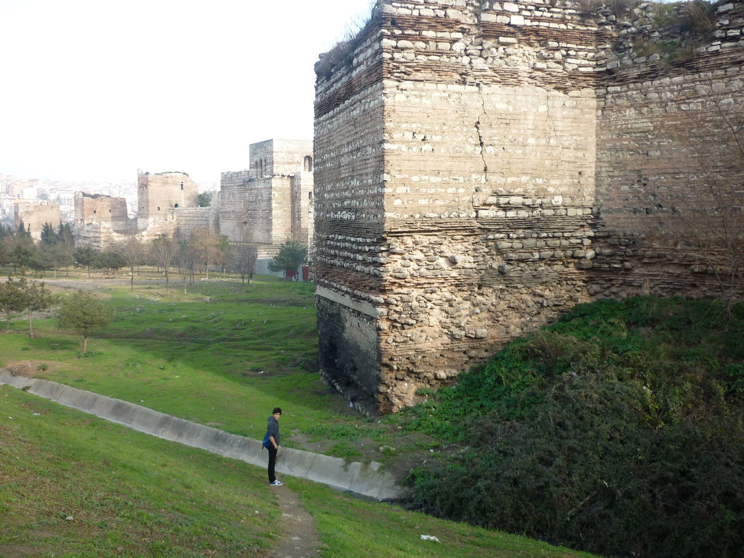 A stretch of the Theodosian Walls, near the Charisian Gate. Only the high inner wall still stands; the outer wall was shattered by the cannons of the Ottoman Turks in the final siege of 1453 (photo by the author)..