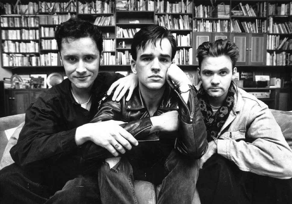 Richard Fidler with Tim Ferguson and Paul McDermott in a library