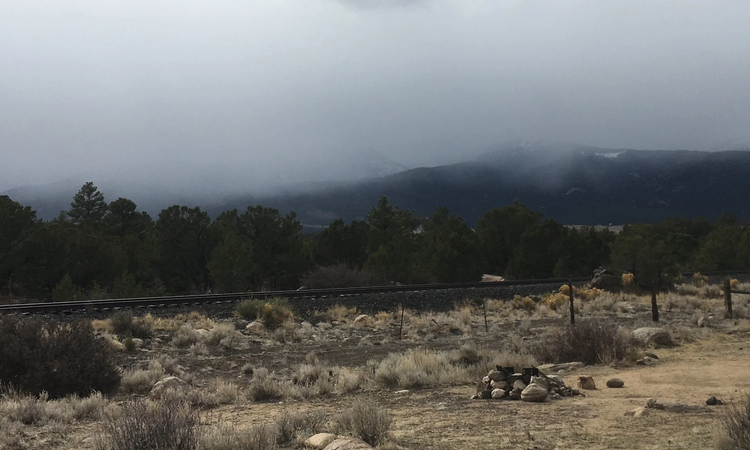 Morning clouds, snow and fog, after a night of rain.