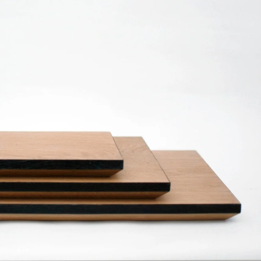 stacked wooden chopping boards side on