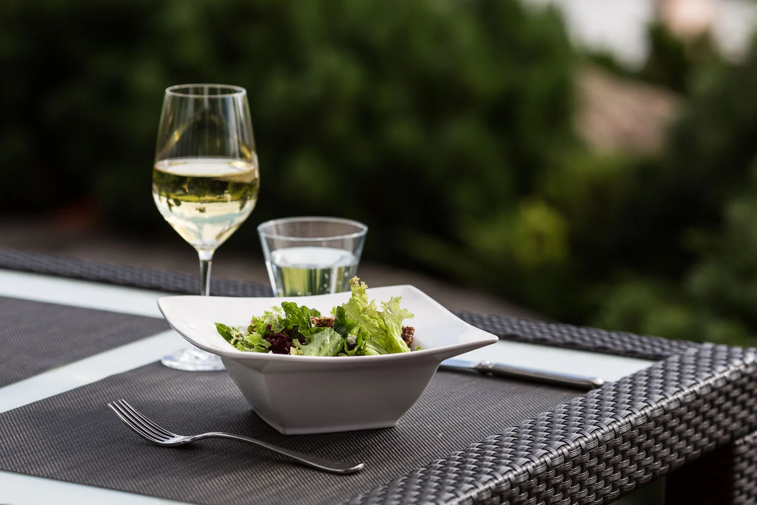 Photograph of food and white wine
