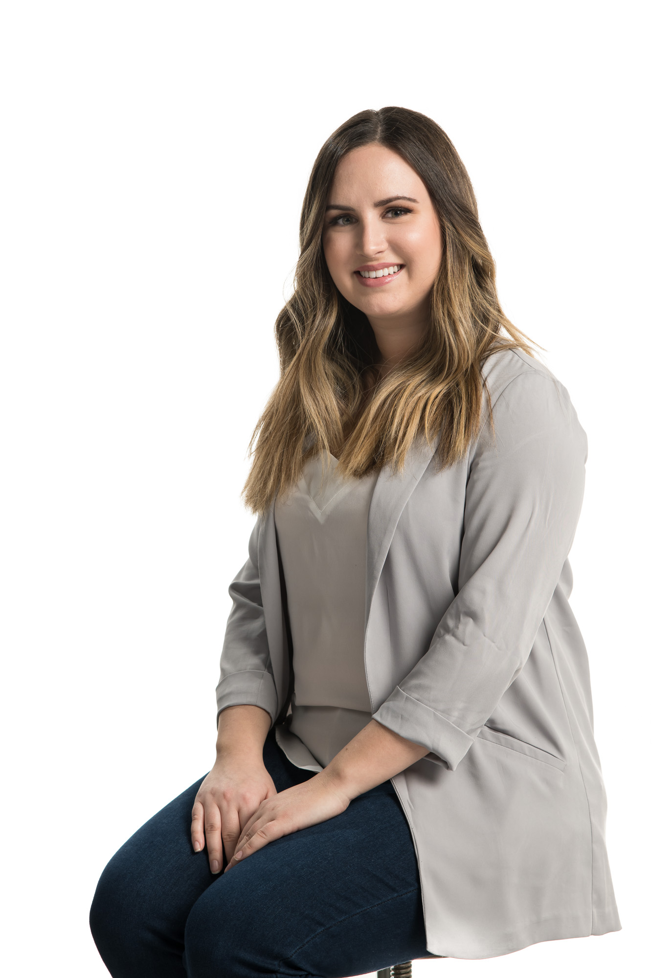 photo of a young female professional on a white backdrop