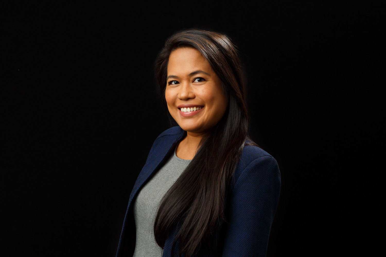 headshot of a woman on black