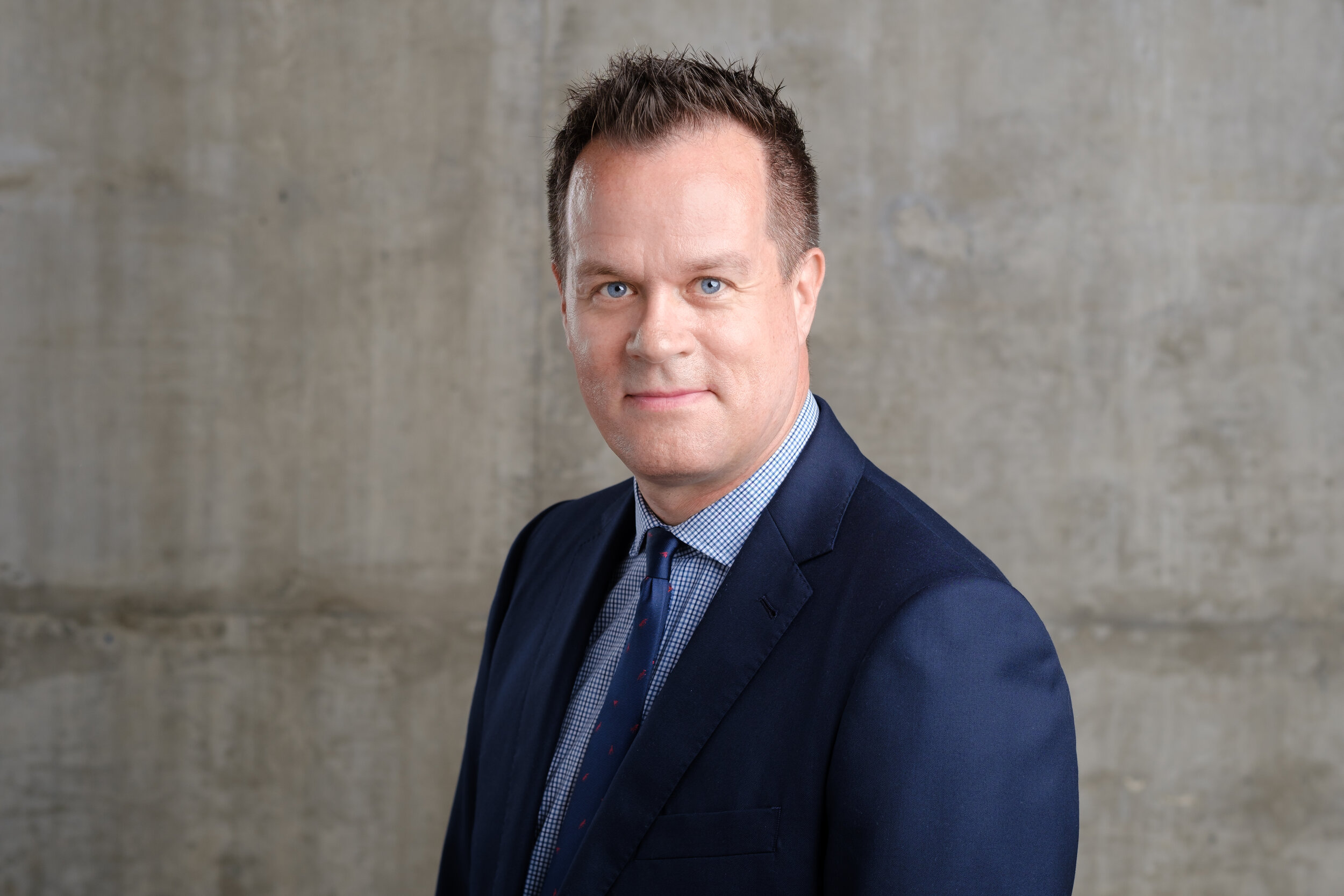 headshot of a male in a suit 