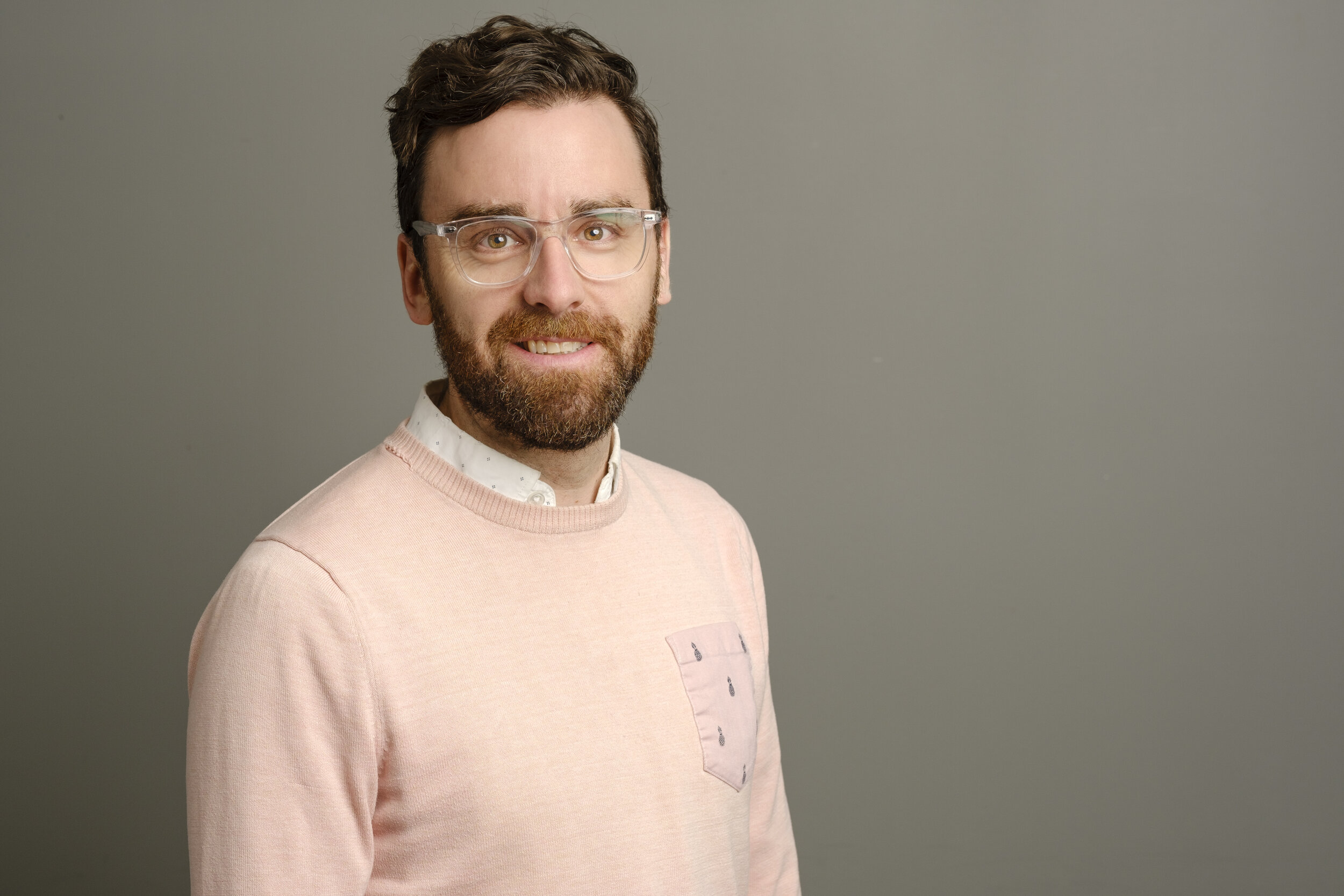 casual headshot of a bearded man