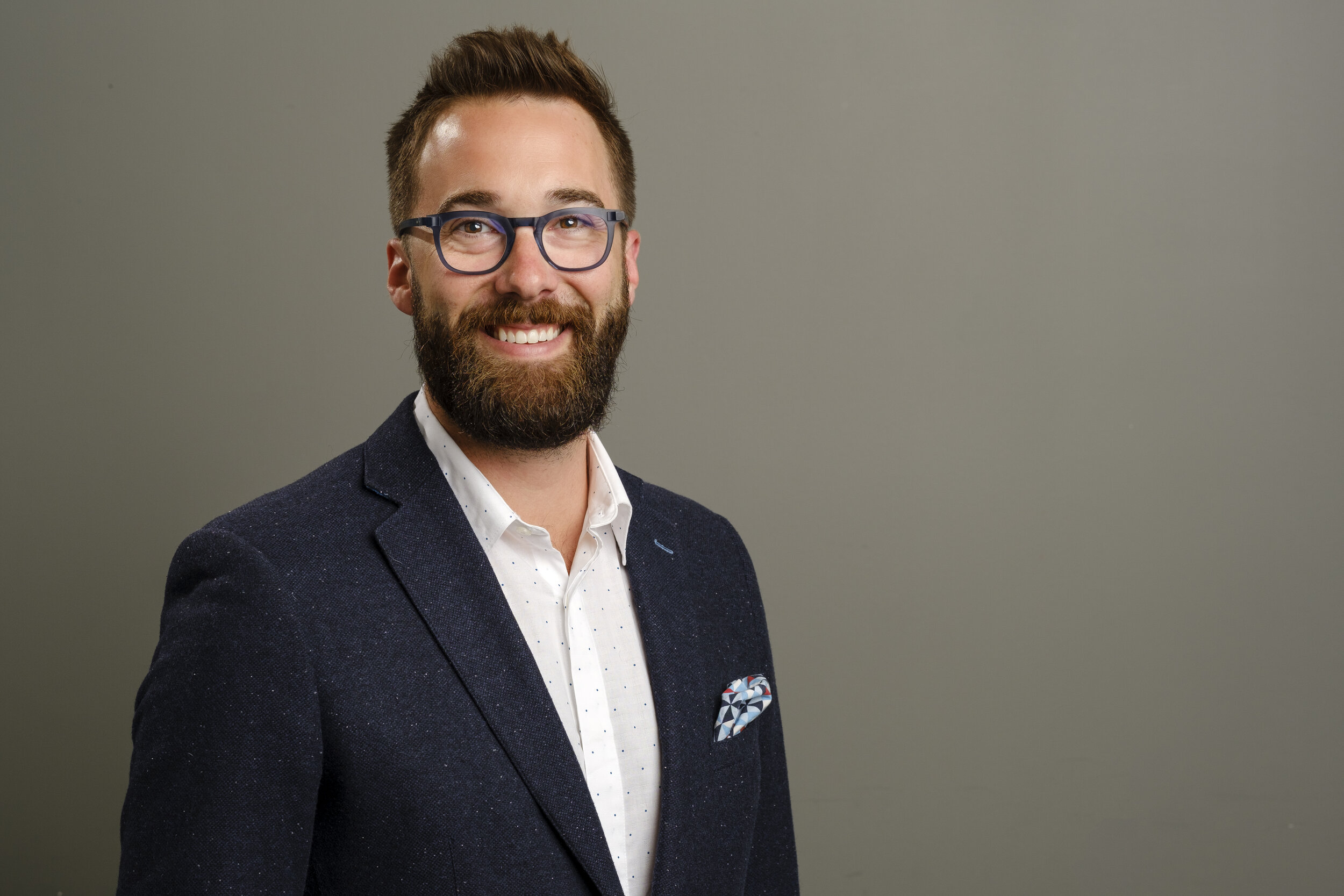 profession photograph of a man on gray