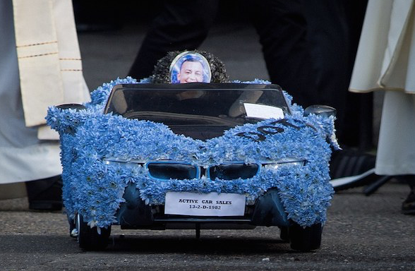   David Byrne 's funeral procession included a remote control car adorned in blue flowers 